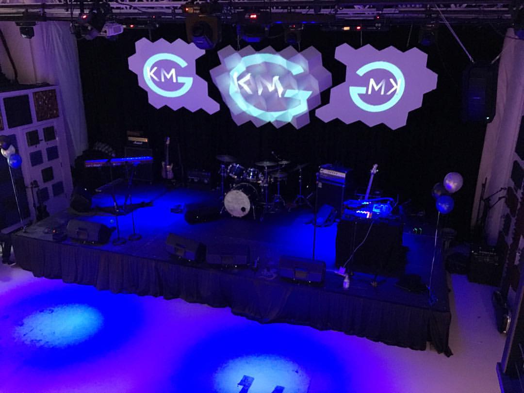 KMG's live-event space and stage view from the VIP balcony area.