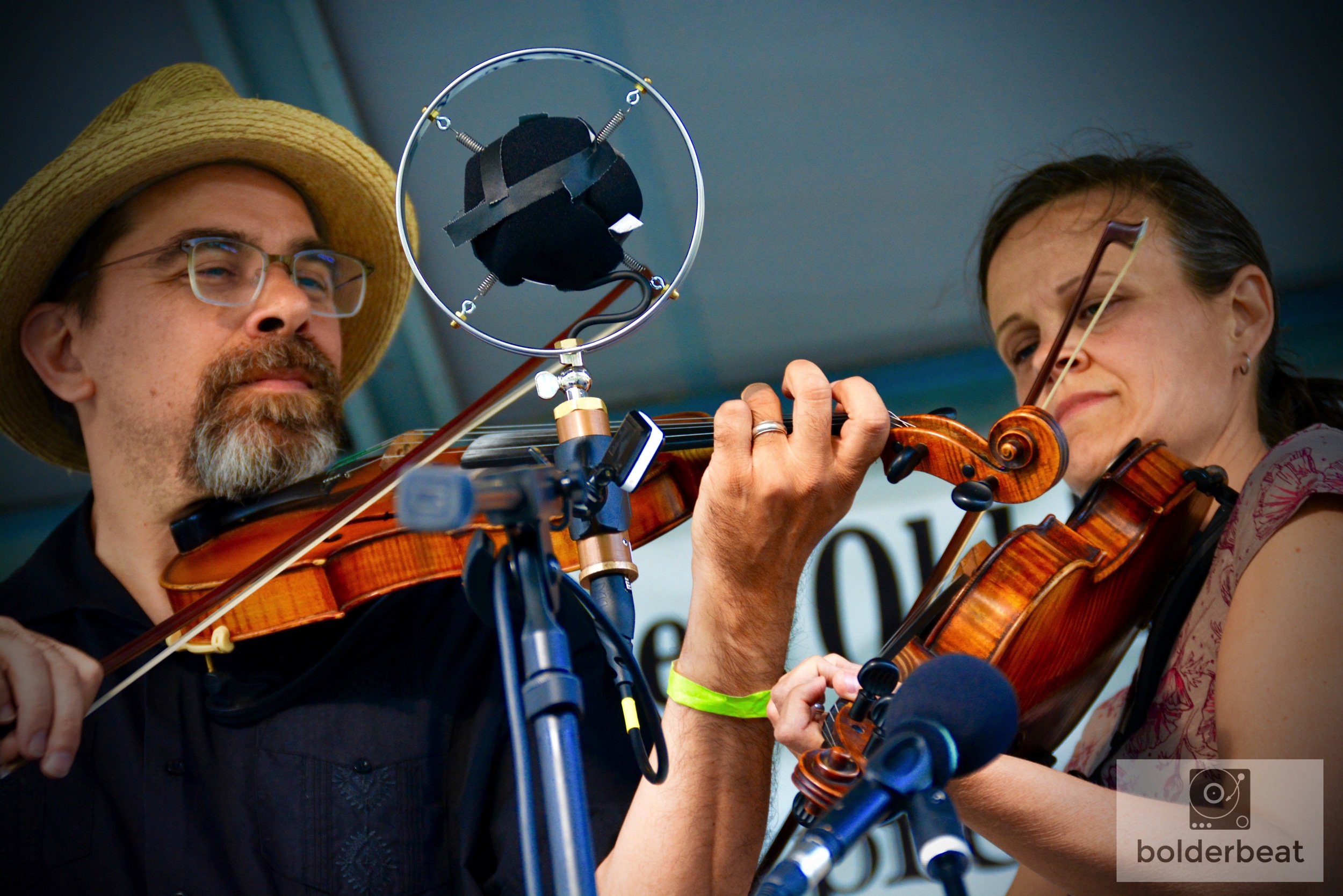 Tricia Spencer and Howard Rains playing twin fiddles onstage at CROMA Festival. Later, the two hosted a workship titled, "Backing Up A Fiddle With A Fiddle."