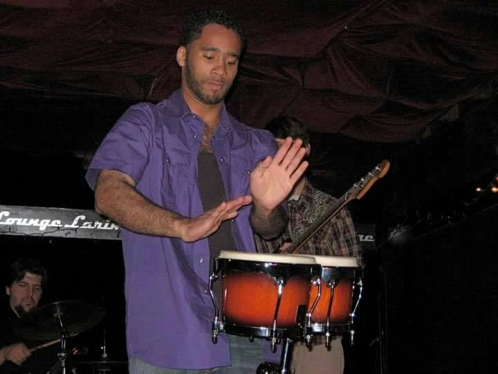Shane playing drums for his college band in 2009 at Larimer Lounge.