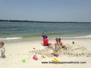 &nbsp;my kids building sandcastles with daddy and uncle