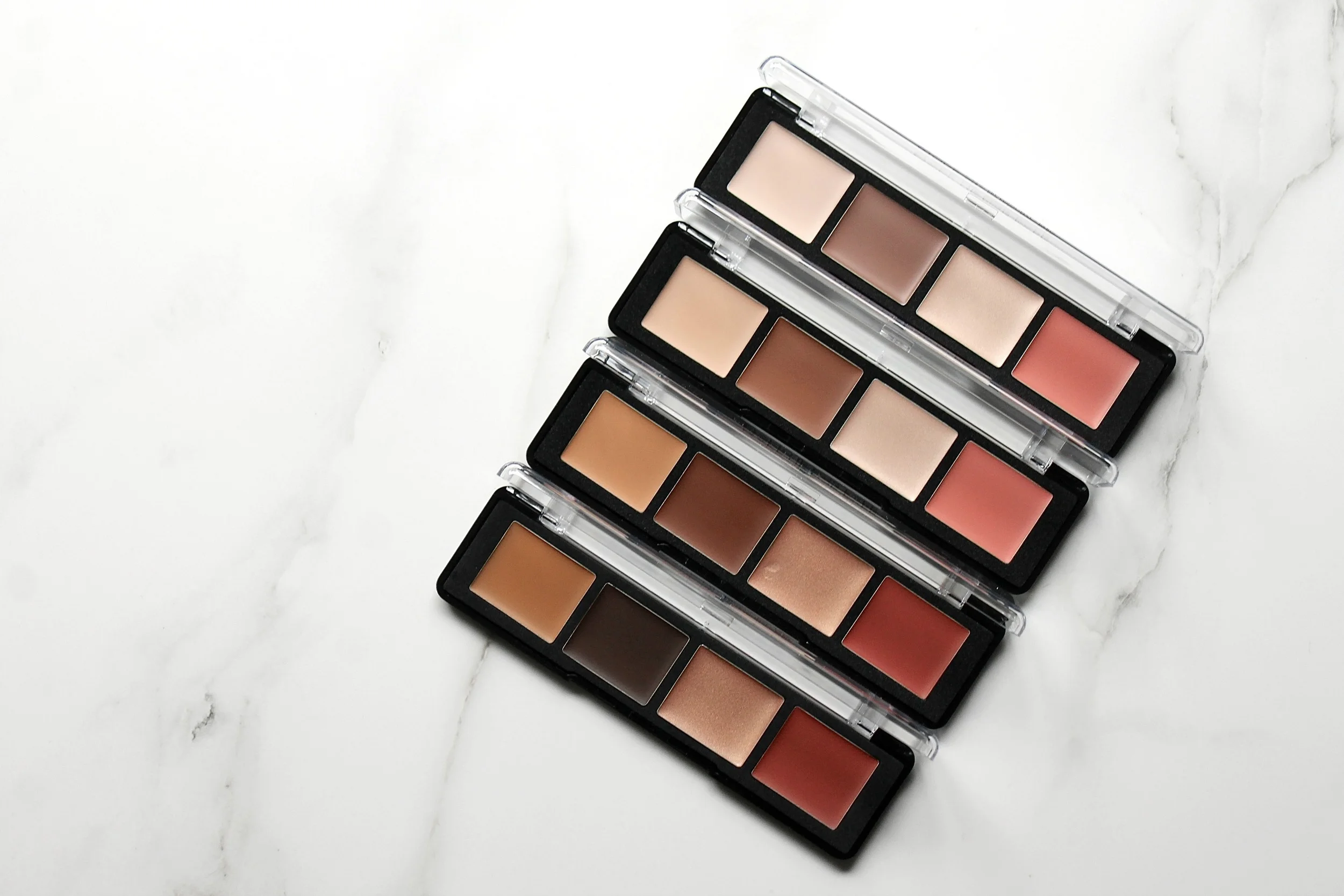PRO SCULPTING FACE PALETTES IN 50 (DARK), 40 (TAN), 30 (MEDIUM), AND 20(LIGHT).