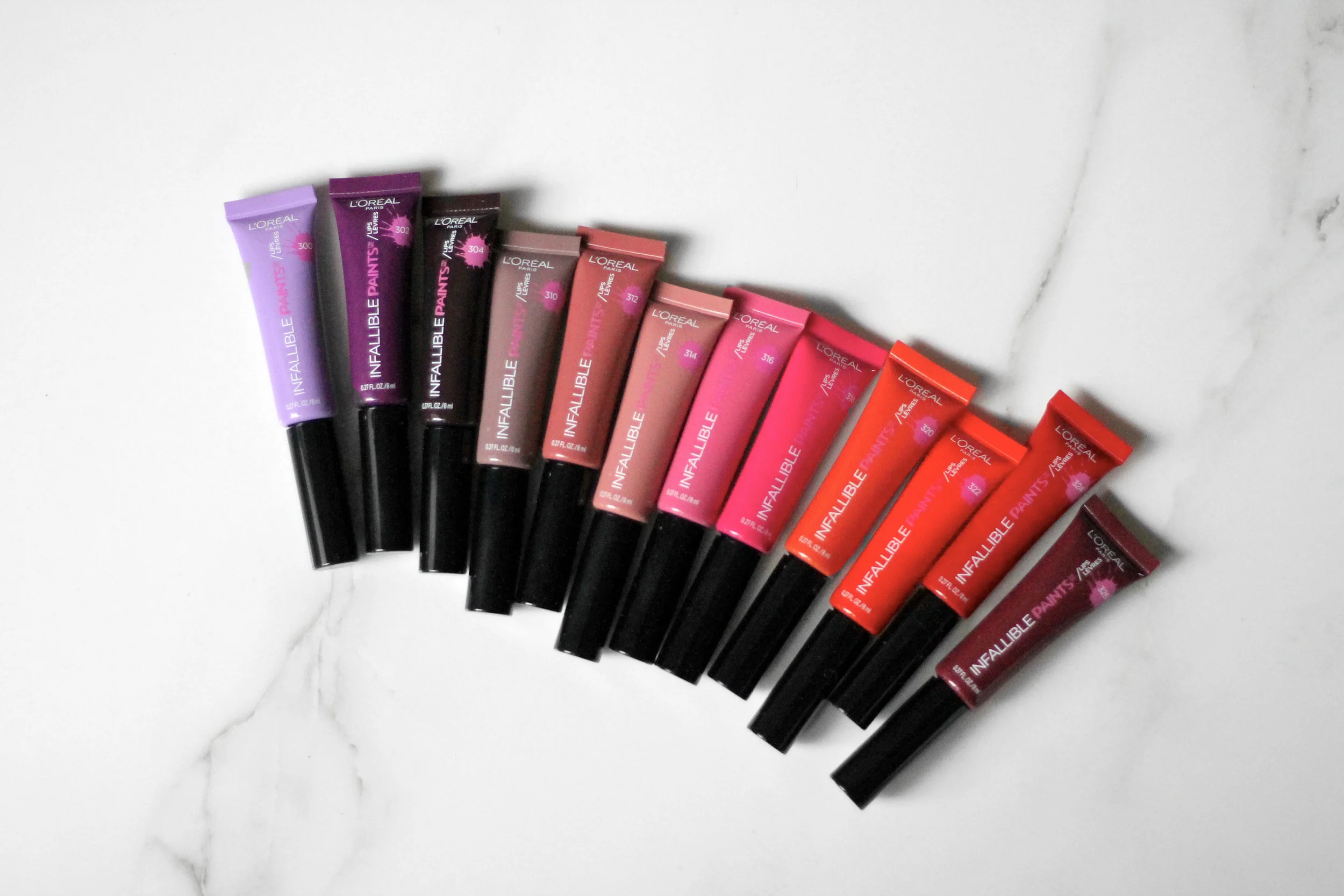 Left to right: Lilac Lust, Violet Twist, Bewitching Bordeaux, Taupeless, Spicy Blush, Nude Star, Wild Rose, Fearless Fuschia, Cool Coral, Orange Envy, DIY Red and Sultry Sangria. 