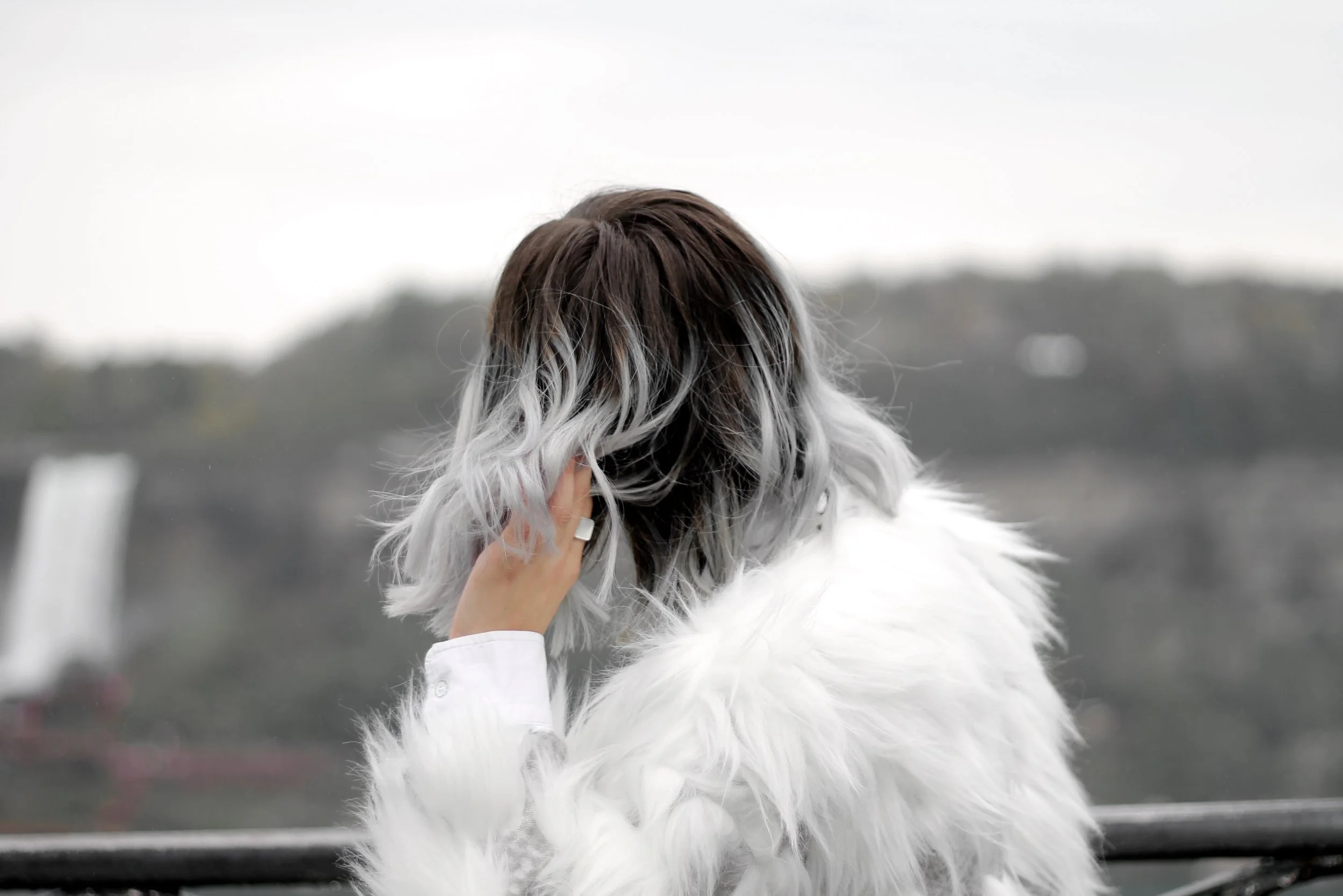 Bratty B posing in faux fur in front of Niagara Falls, ON Canada taken by Elaisha Jade