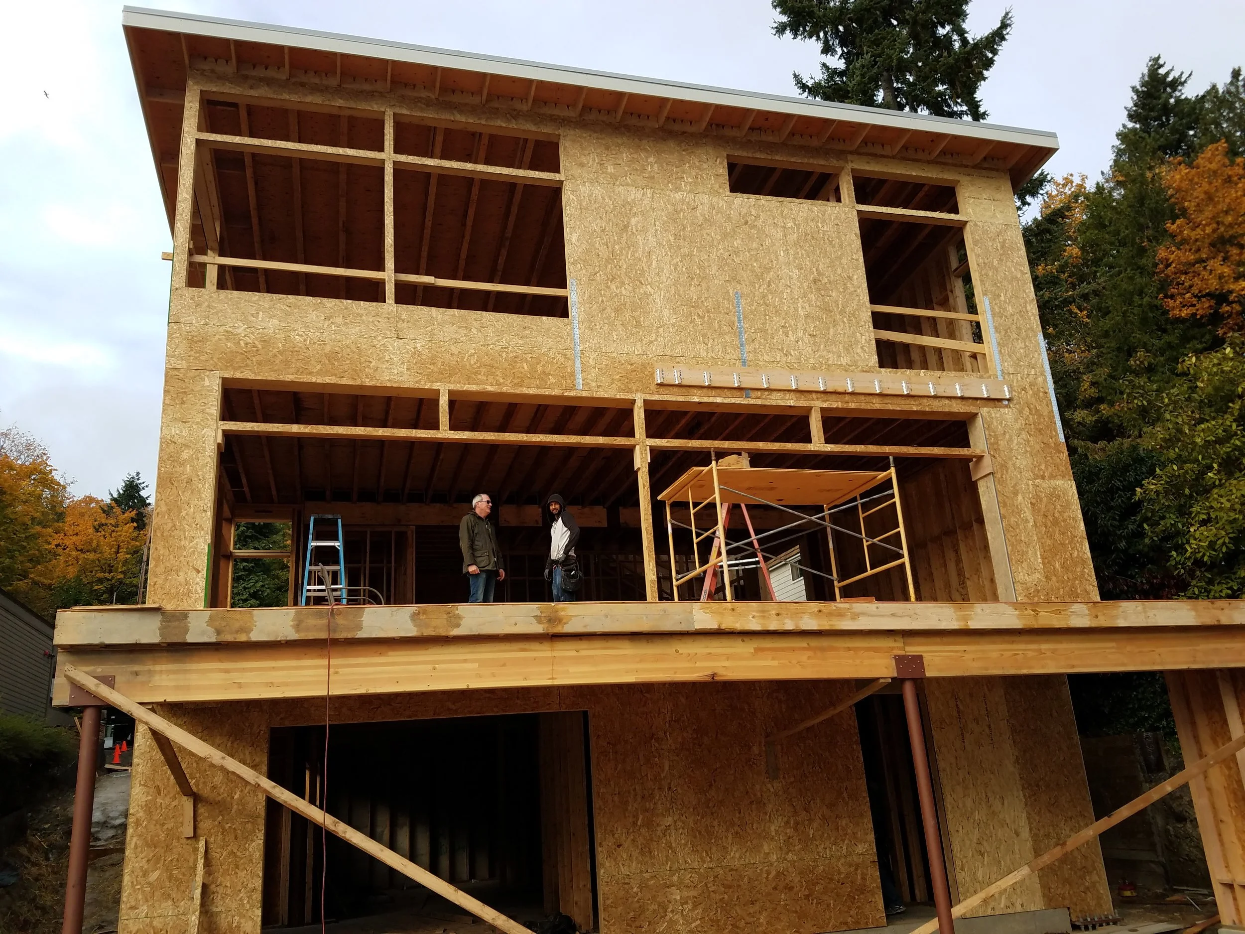 This home will enjoy maximum and unobstructed views of Lake Washington. In order to support three stories of windows, steel instrumentally supports the rest of the wood frame structure.