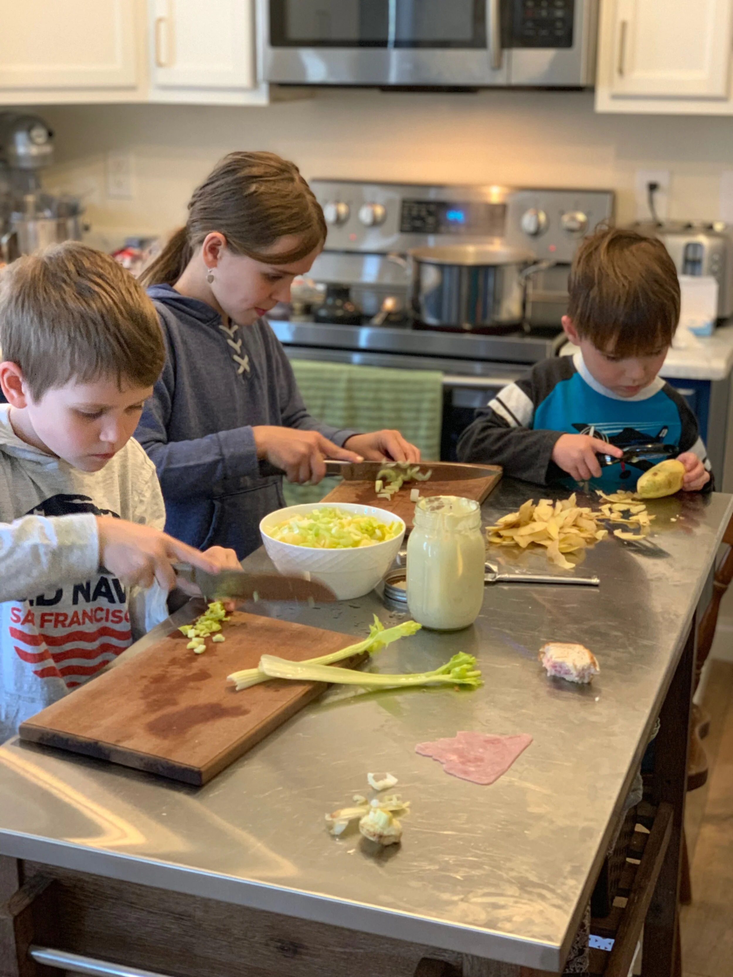 Potato salad in the making. I love that I can just ask them, give them instructions and watch it all come together.