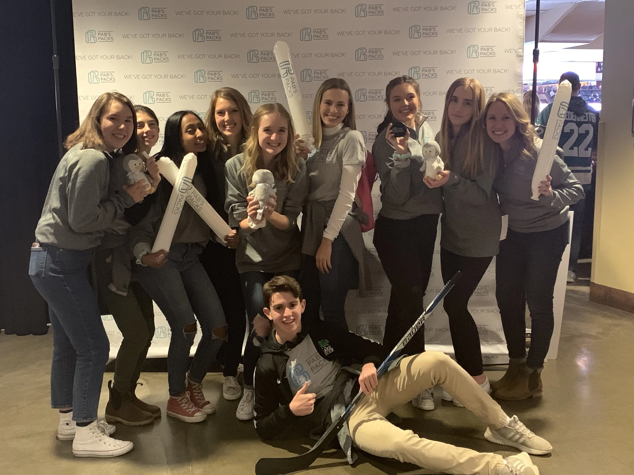 The PAB’S PACKS Teen Ambassador Board celebrating at a the Xcel Center as the MN Wild Charity of the Month in November, 2018.