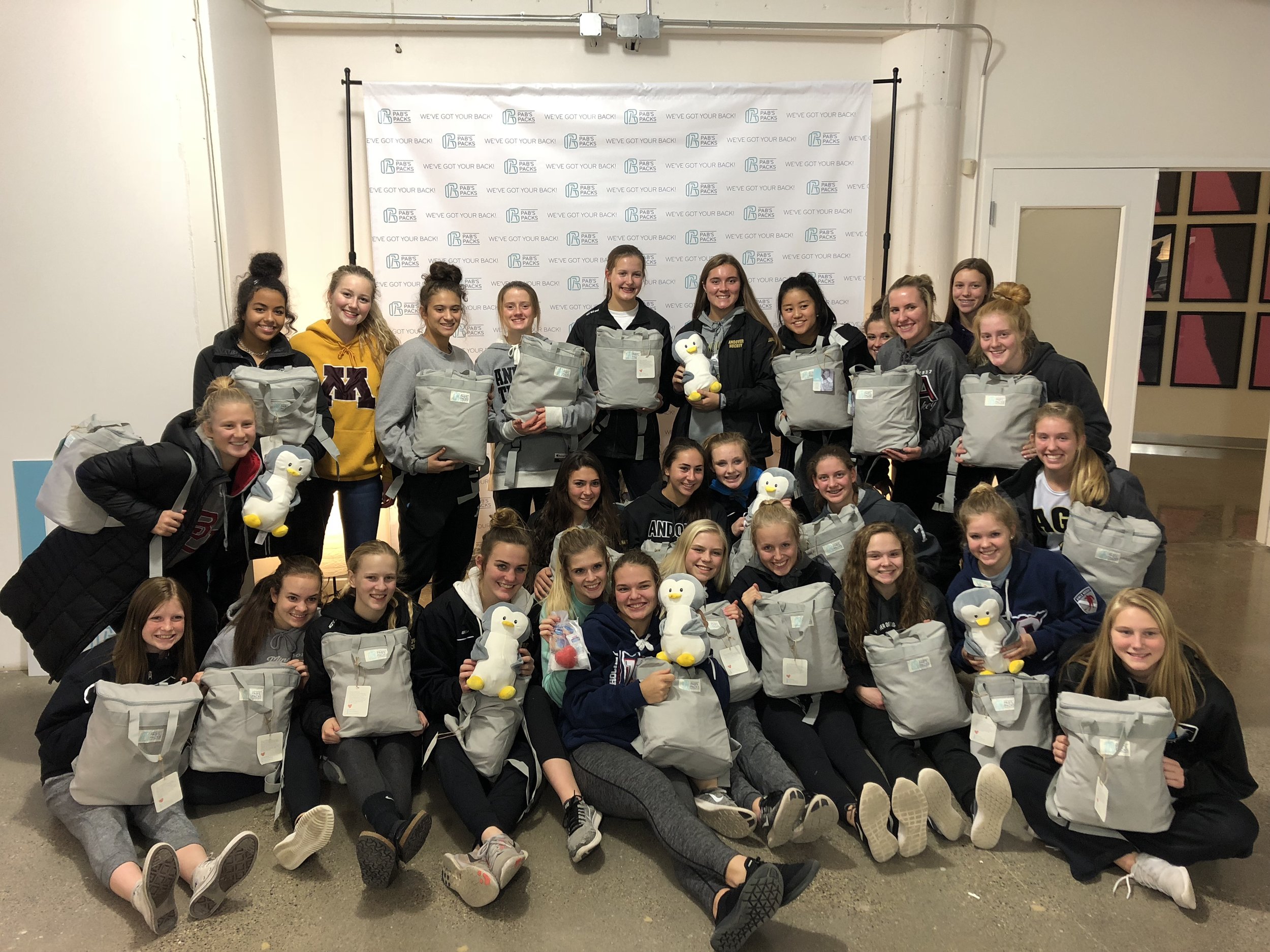 The Andover Girls Hockey Team broke our office packing record: 30 participants and 200 backpacks packed! We are grateful to First & First, for donating space.
