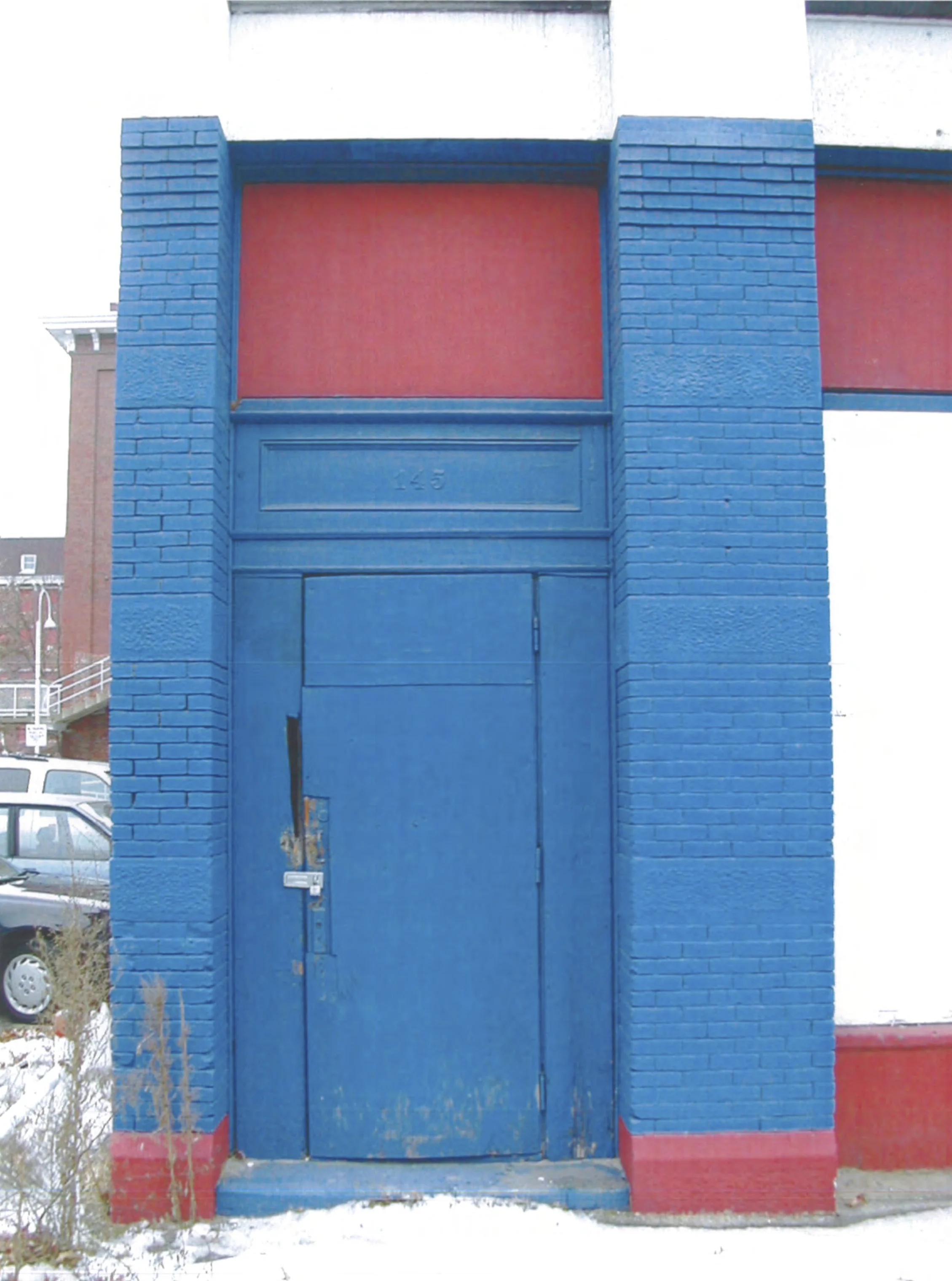 The Twin Cities Boxing Club had painted the ground floor of the facade red, white and blue. The paint had to be removed carefully to restore the building to historic standards.