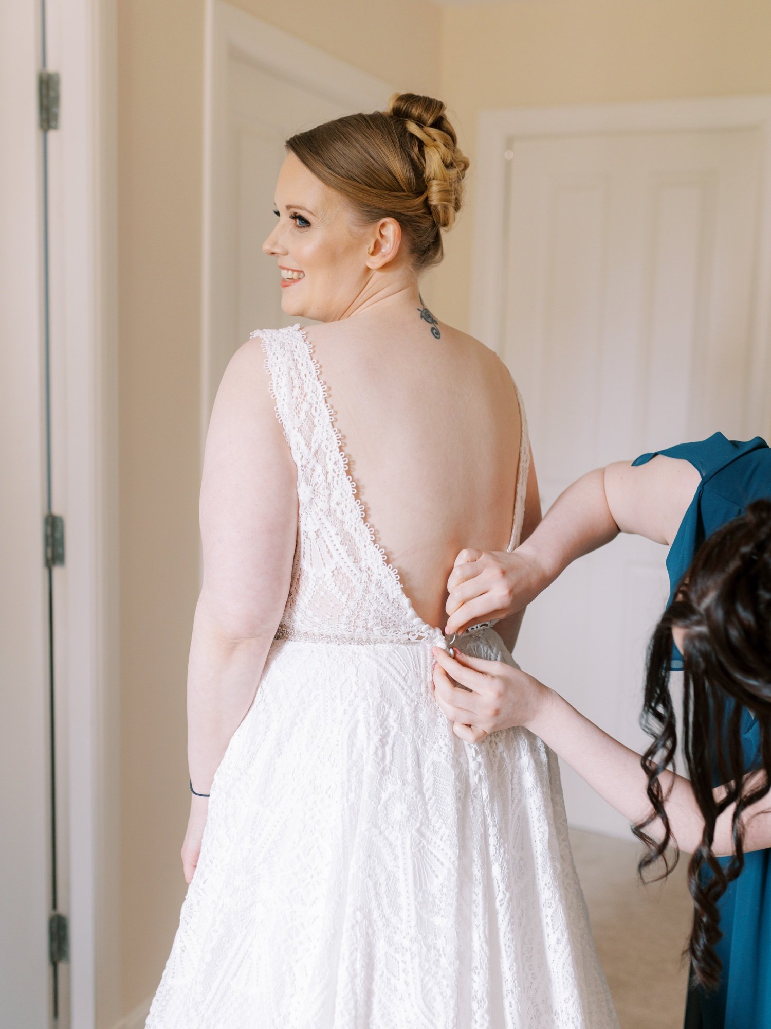 04_bride getting her wedding dress on .jpg