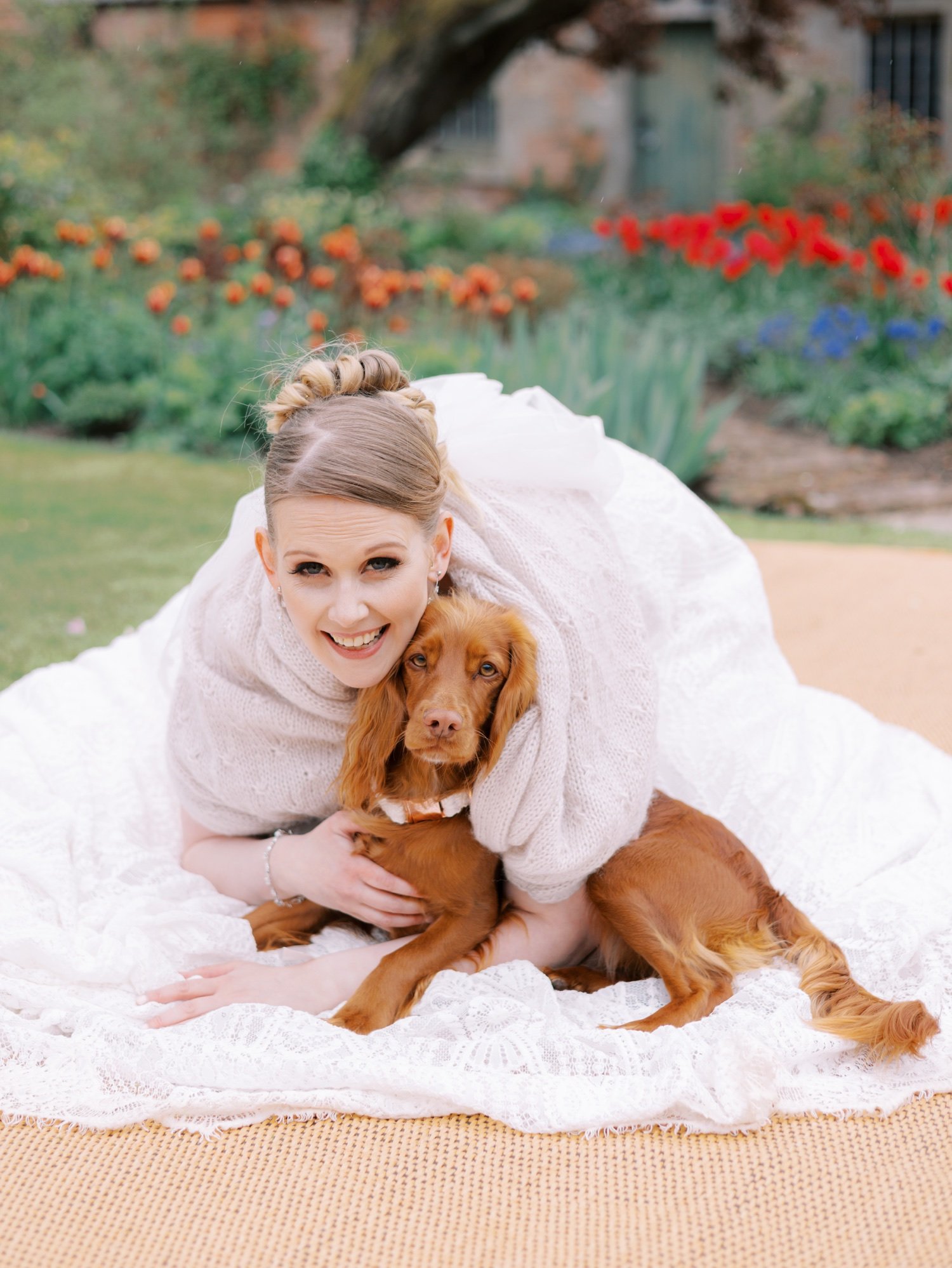 34_bride smiling with her dog at leuchie walled garden near north berwick east lothian scotland.jpg