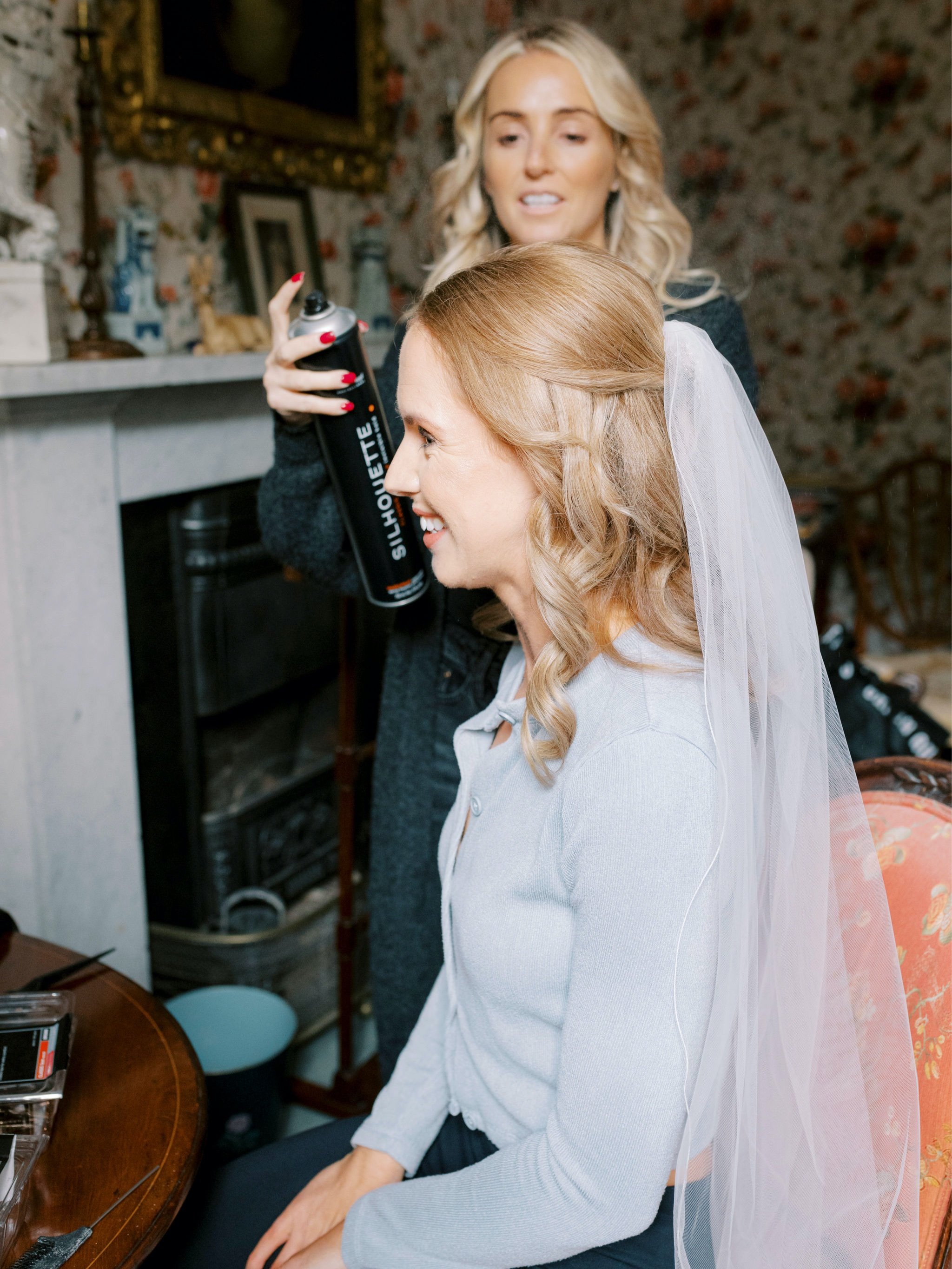 05_wedding photographer kirknewton house stables edinburgh bride getting hair done .jpg