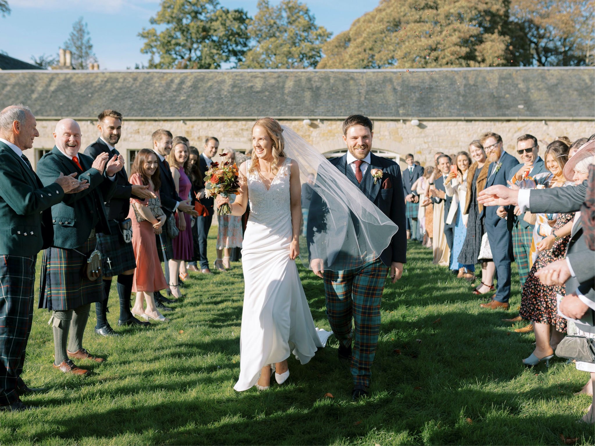 18_wedding photographer kirknewton house stables edinburgh confetti tunnel.jpg