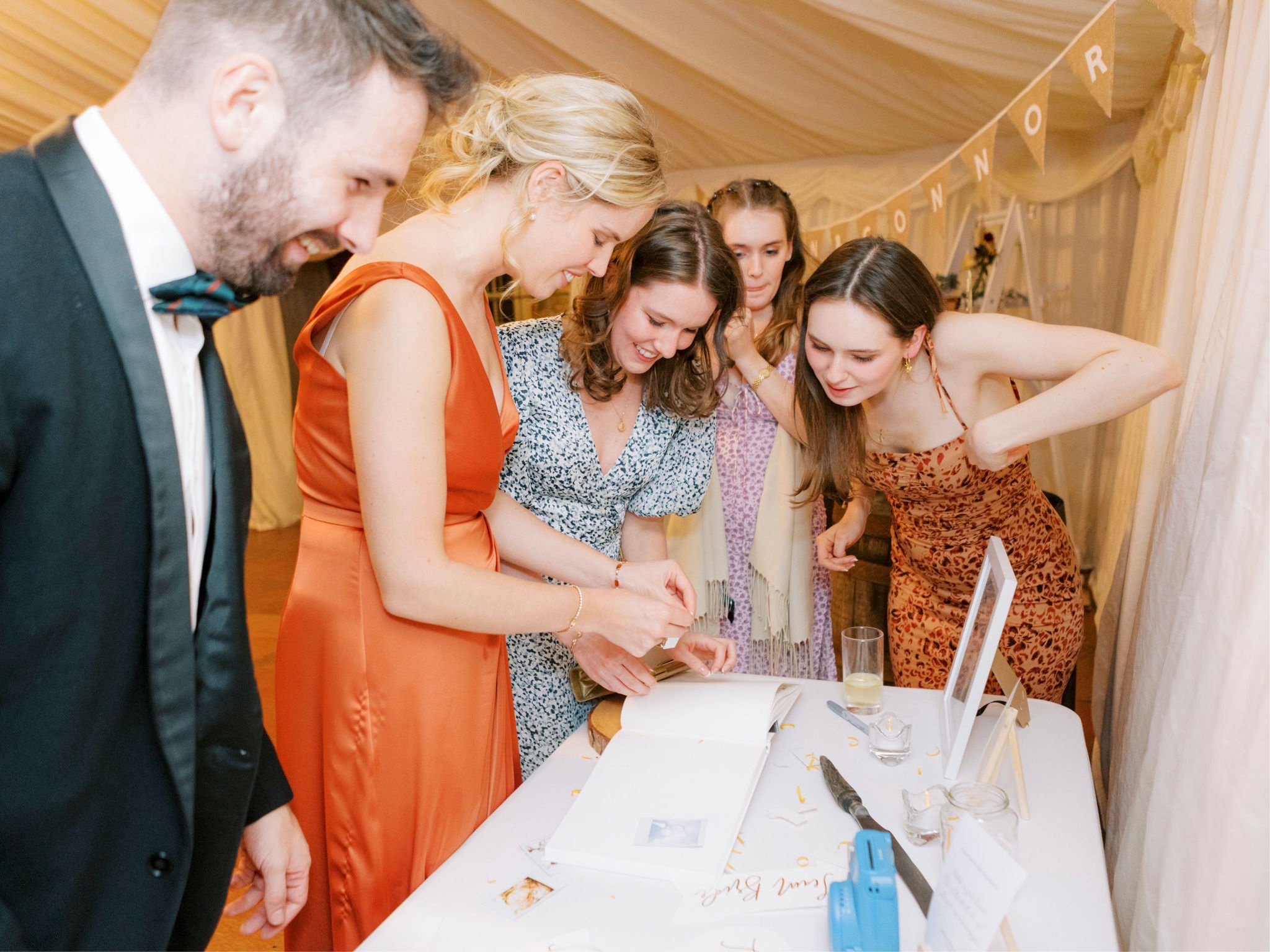 49_wedding photographer kirknewton house stables edinburgh guests signing the guest book.jpg