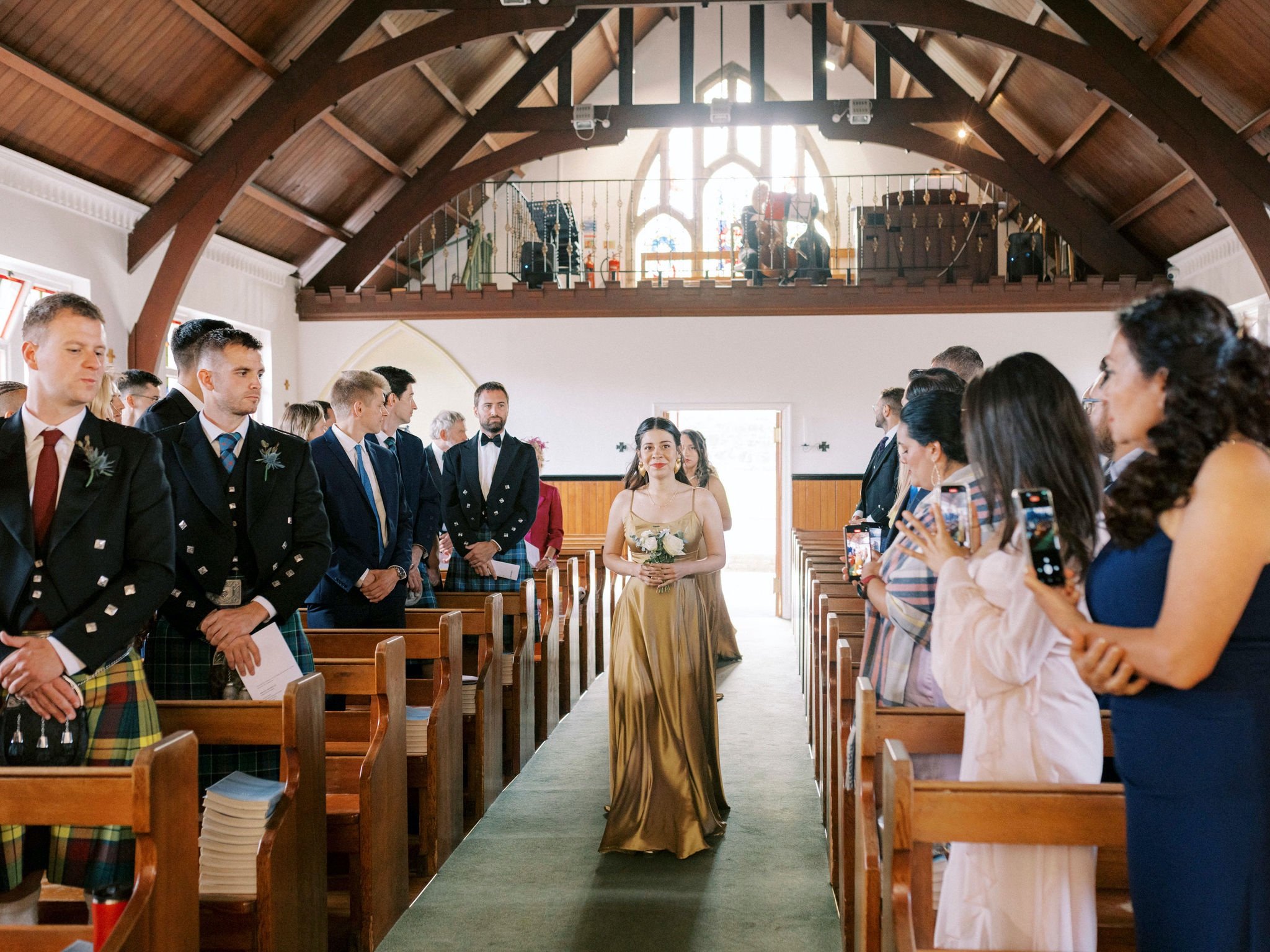 11_bridesmaids walking down aisle St Margaret's Catholic Church South Queensferry Edinburgh.jpg