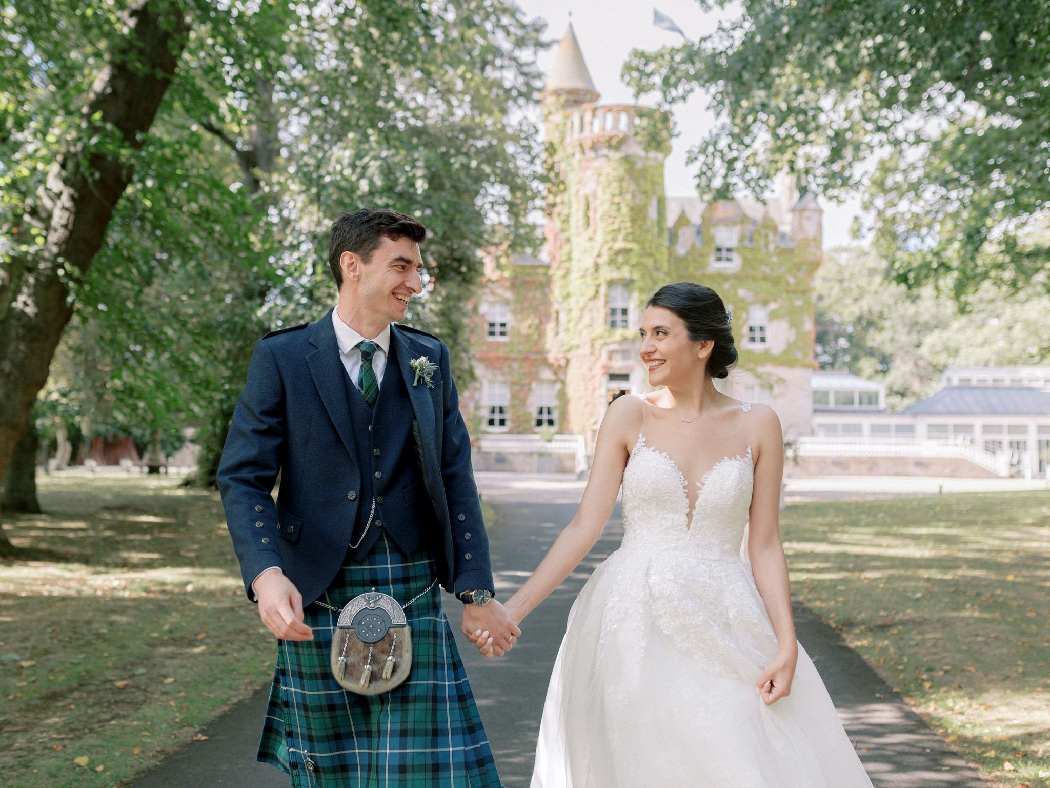 21_carlowrie castle edinburgh wedding photographer bride and groom smiling at each other.jpg