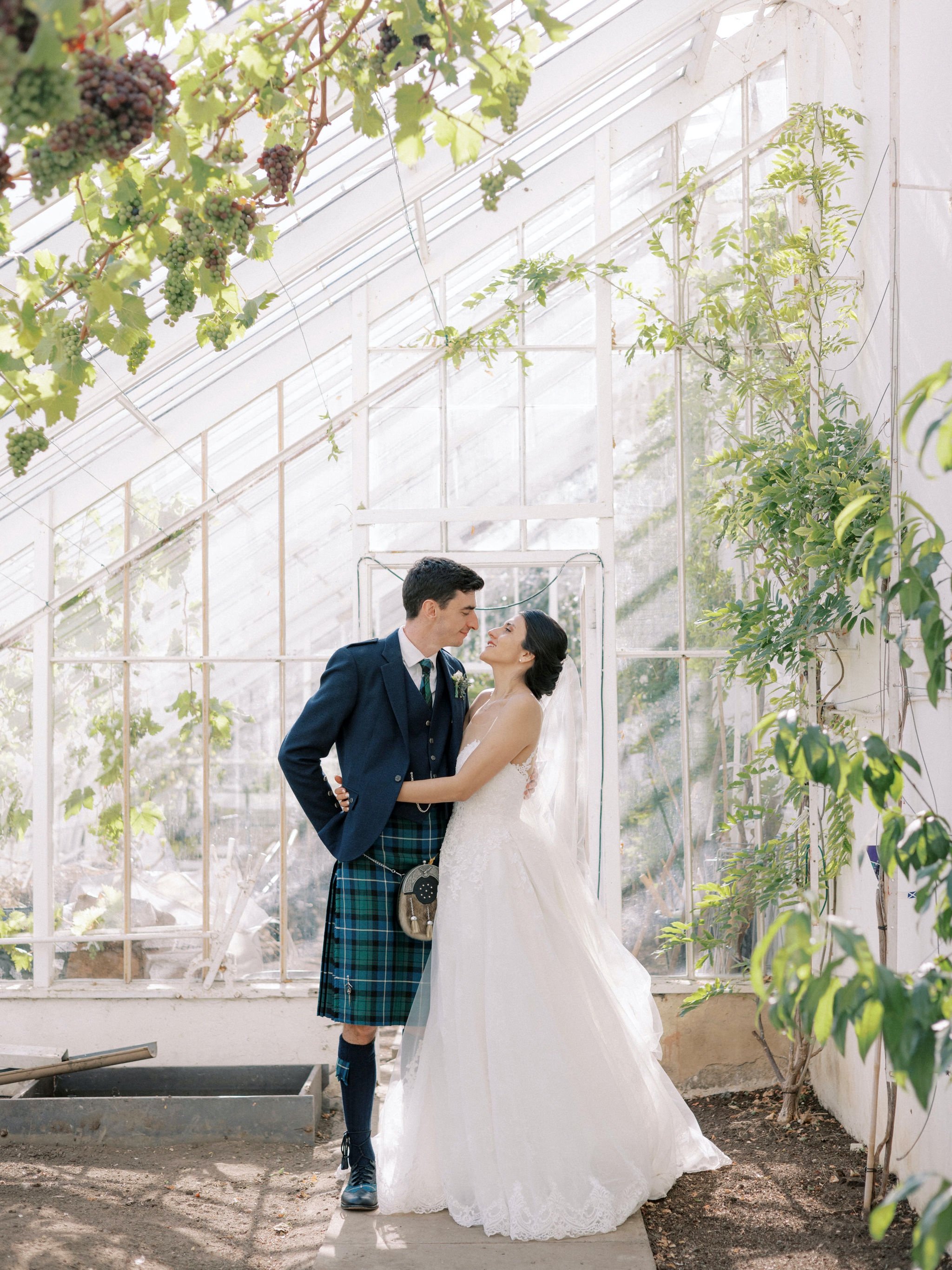 29_carlowrie castle edinburgh wedding photographer bride and groom in greenhouse.jpg