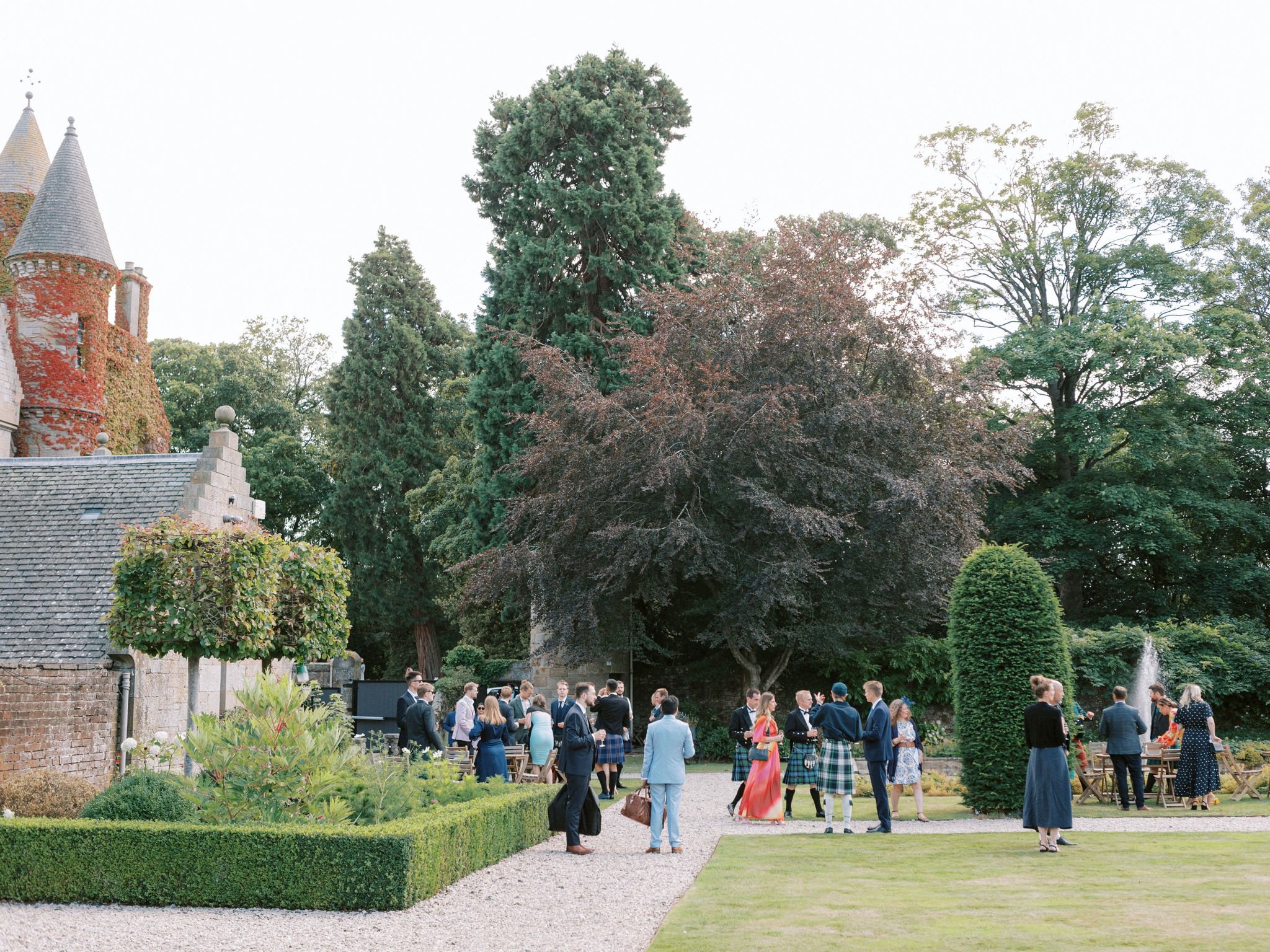 38_carlowrie castle edinburgh wedding photographer guests in the grounds during reception.jpg