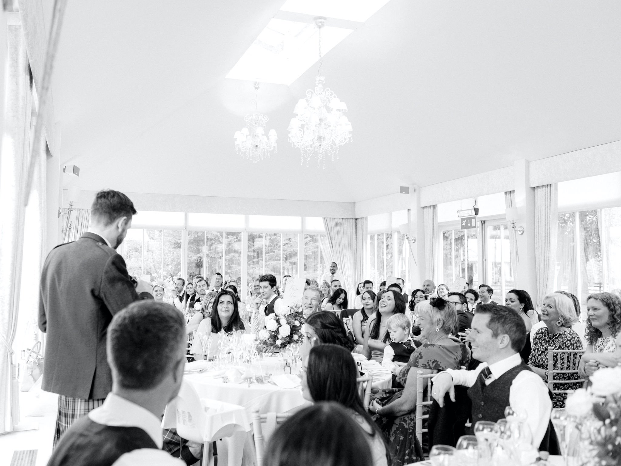 51_carlowrie castle edinburgh wedding photographer guests watching speeches.jpg