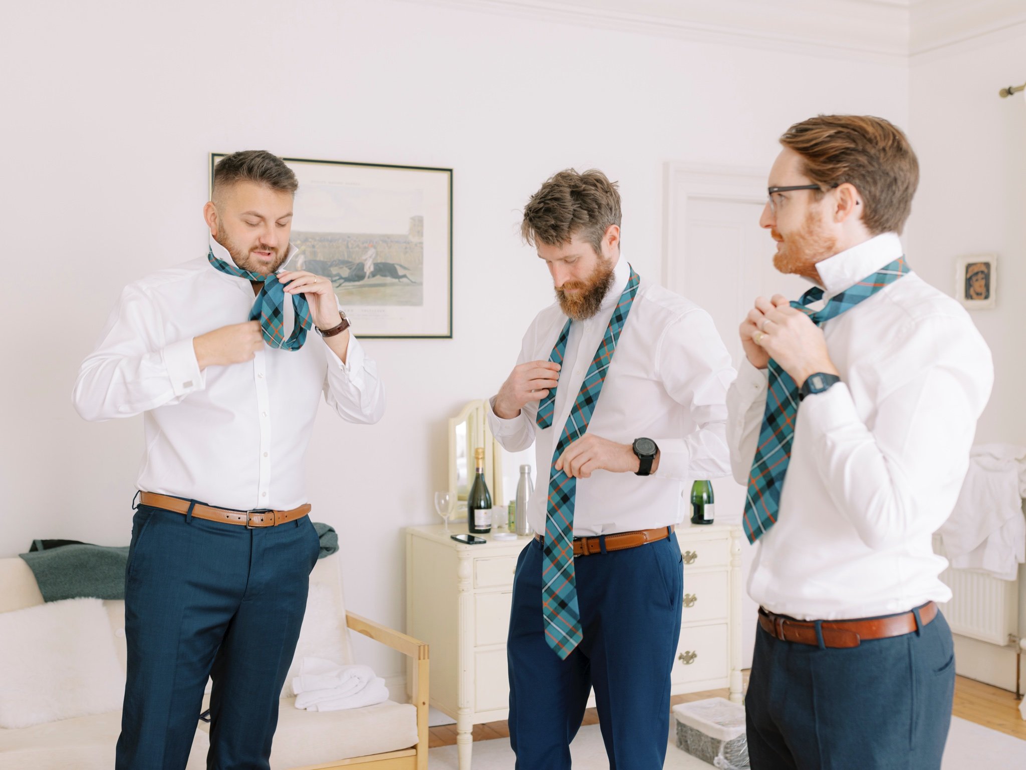 11_wedderlie house melrose scottish borders wedding photographer groomsmen putting on ties .jpg