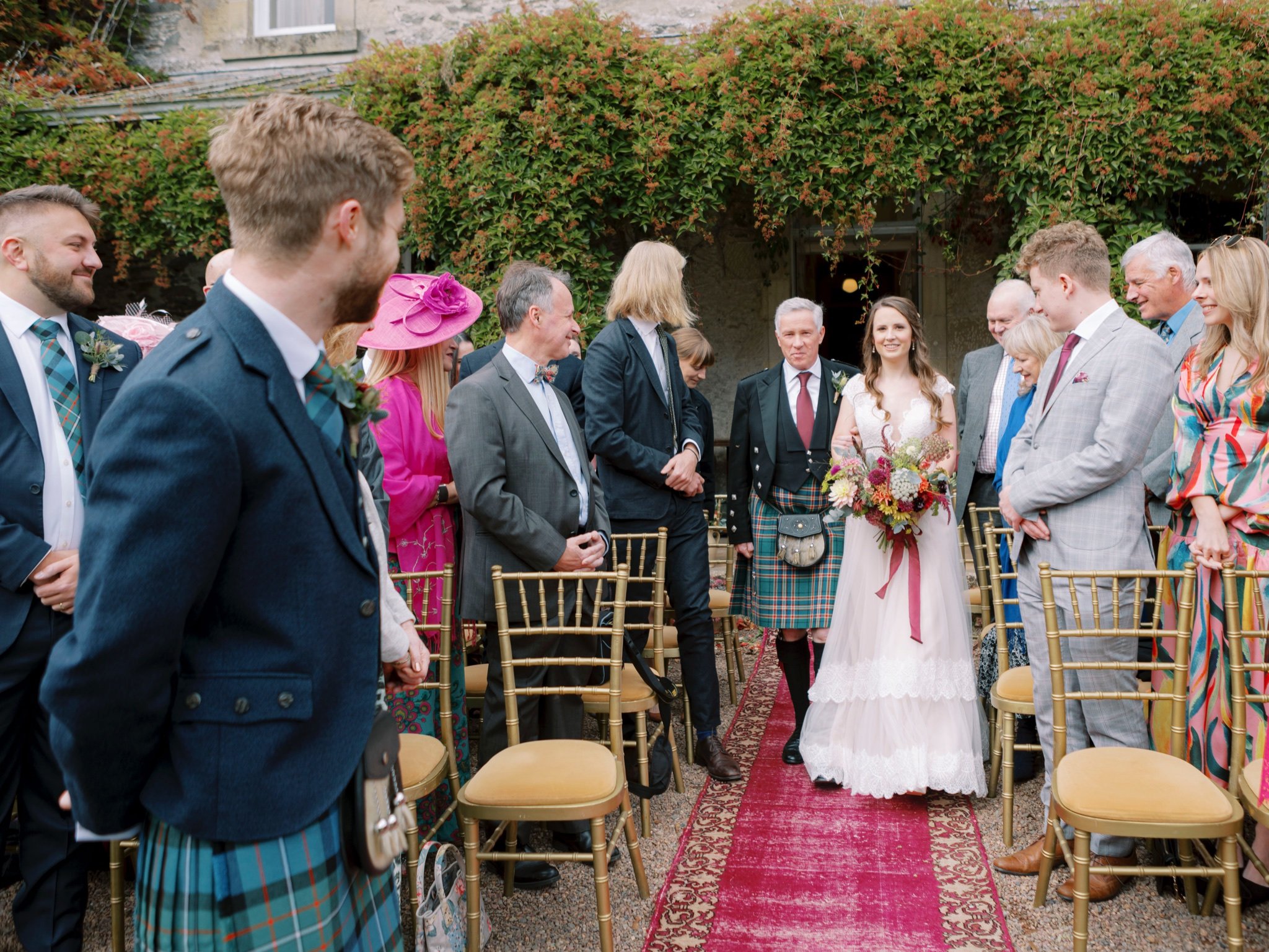 16_wedderlie house melrose scottish borders wedding photographer bride walking down aisle with dad .jpg