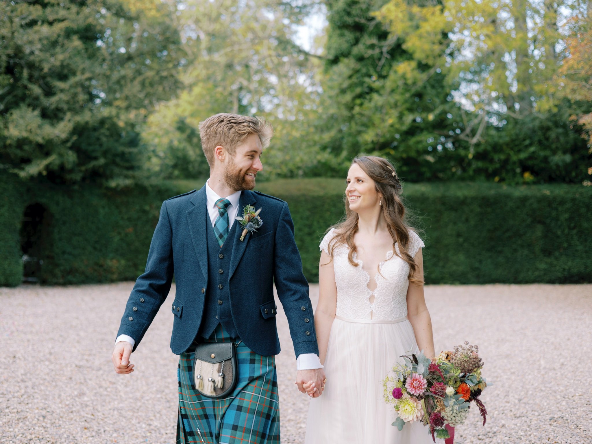 25_wedderlie house melrose scottish borders wedding photographer bride and groom walking .jpg