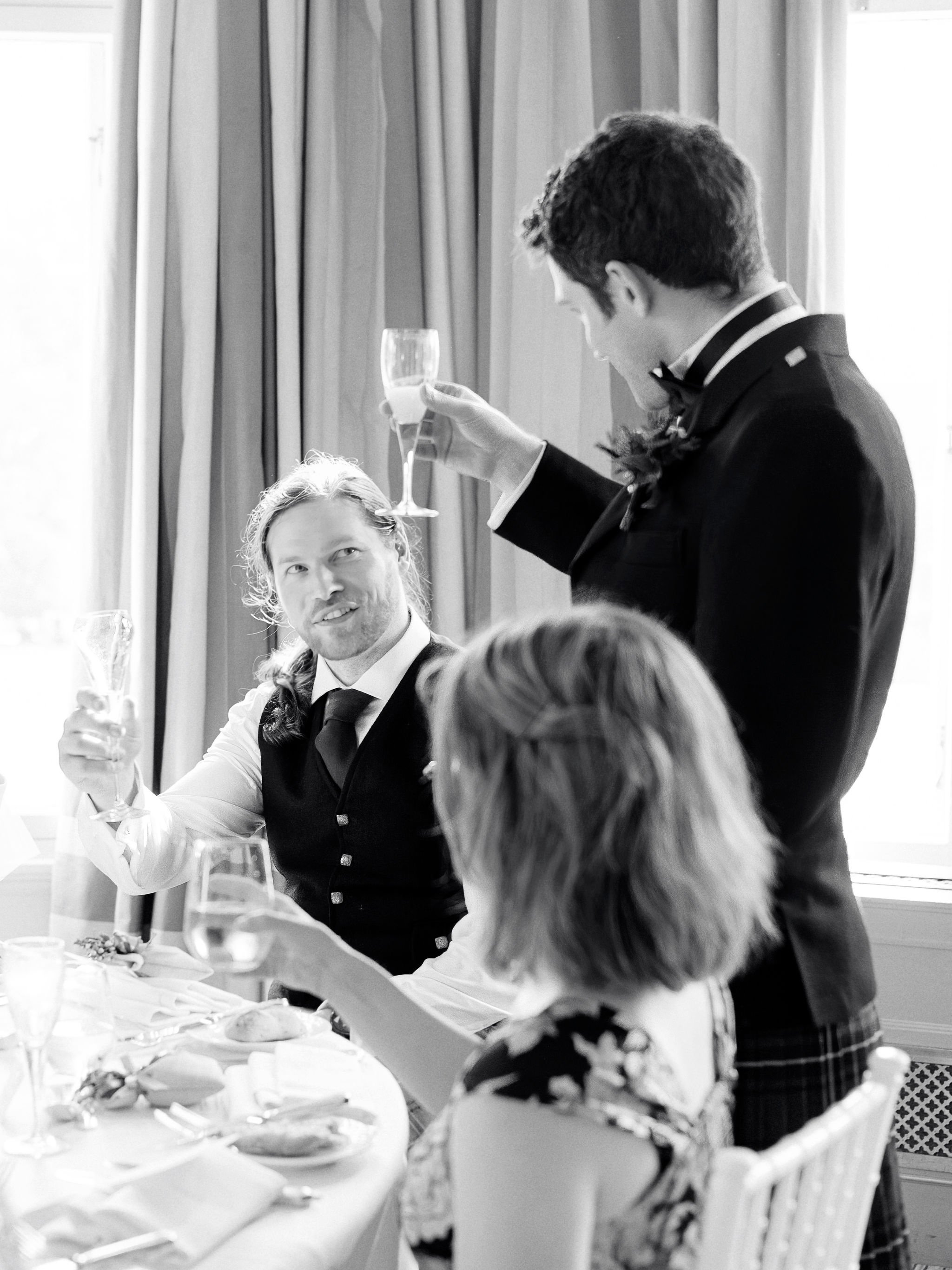 56_balmoral-hotel-edinburgh-wedding-photographer-groom-cheers.jpg