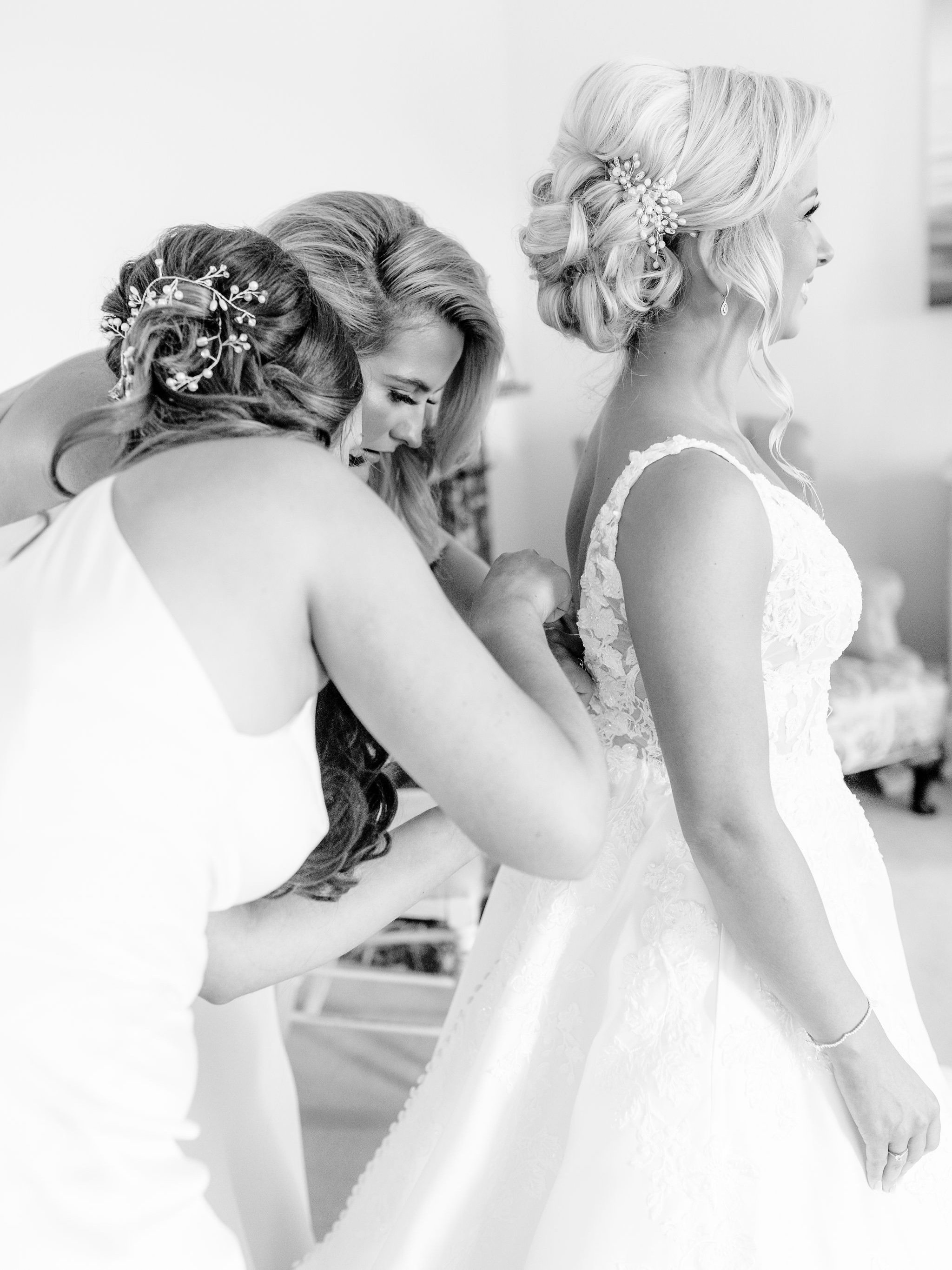 12_springkell-house-wedding-photographer-dumfries-scotland-bride-getting-in-dress.jpg
