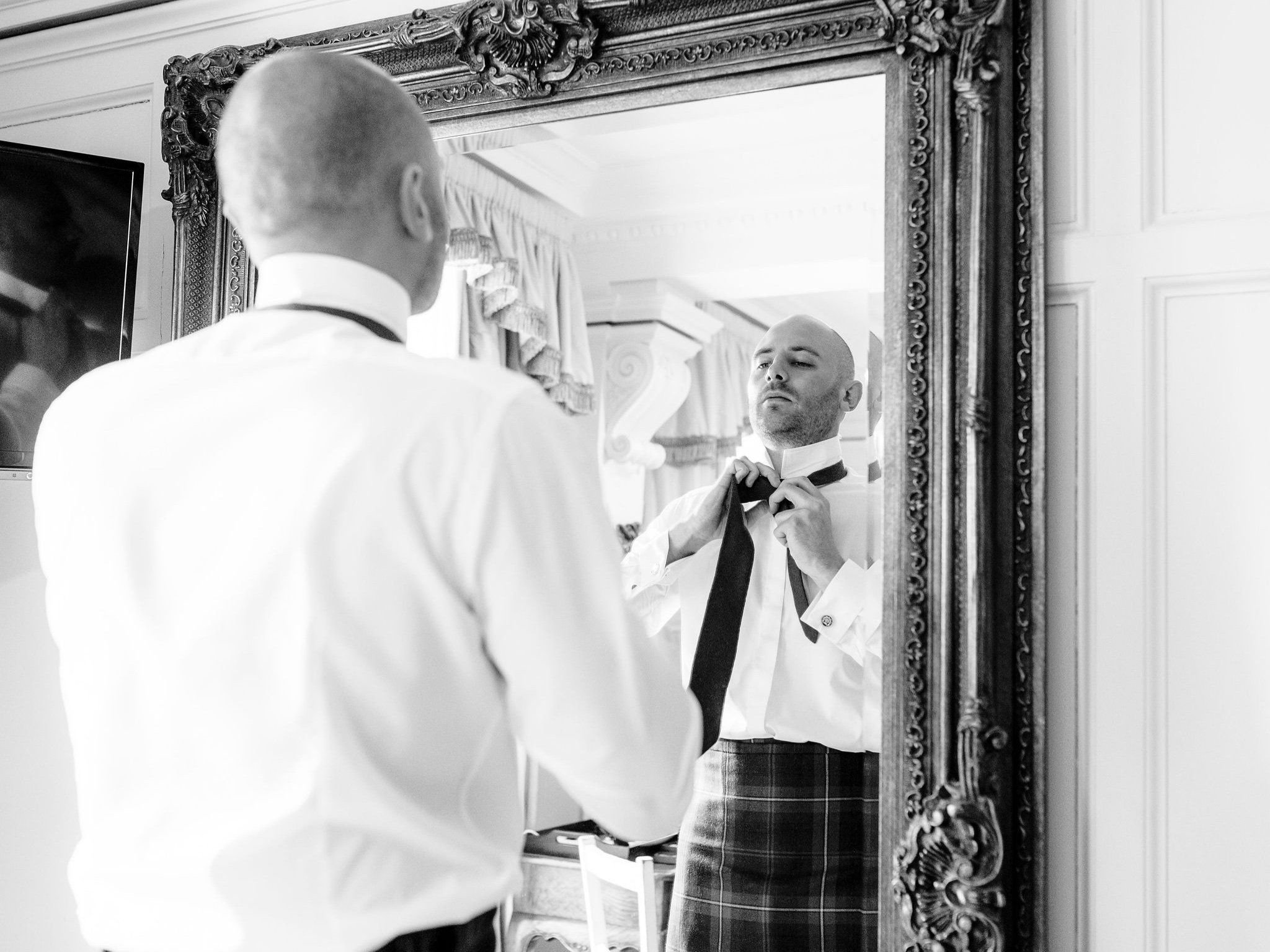 15_springkell-house-wedding-photographer-dumfries-scotland-groom-tartan-tie.jpg