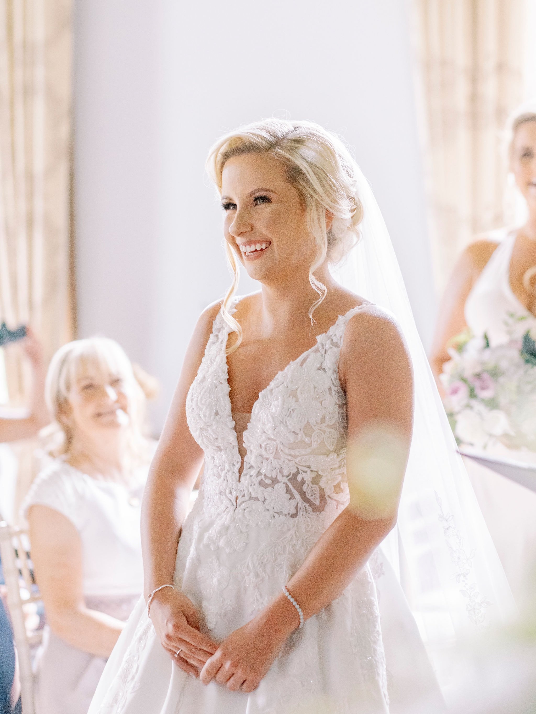 22_springkell-house-wedding-photographer-dumfries-scotland-bride-smiling-ceremony.jpg