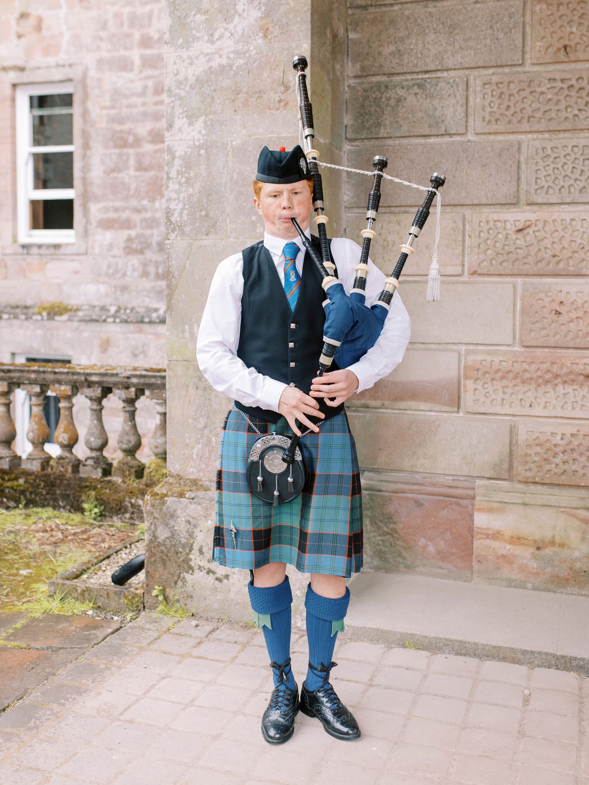 48_springkell-house-wedding-photographer-dumfries-scotland-bagpipes-piper-bagpiper.jpg