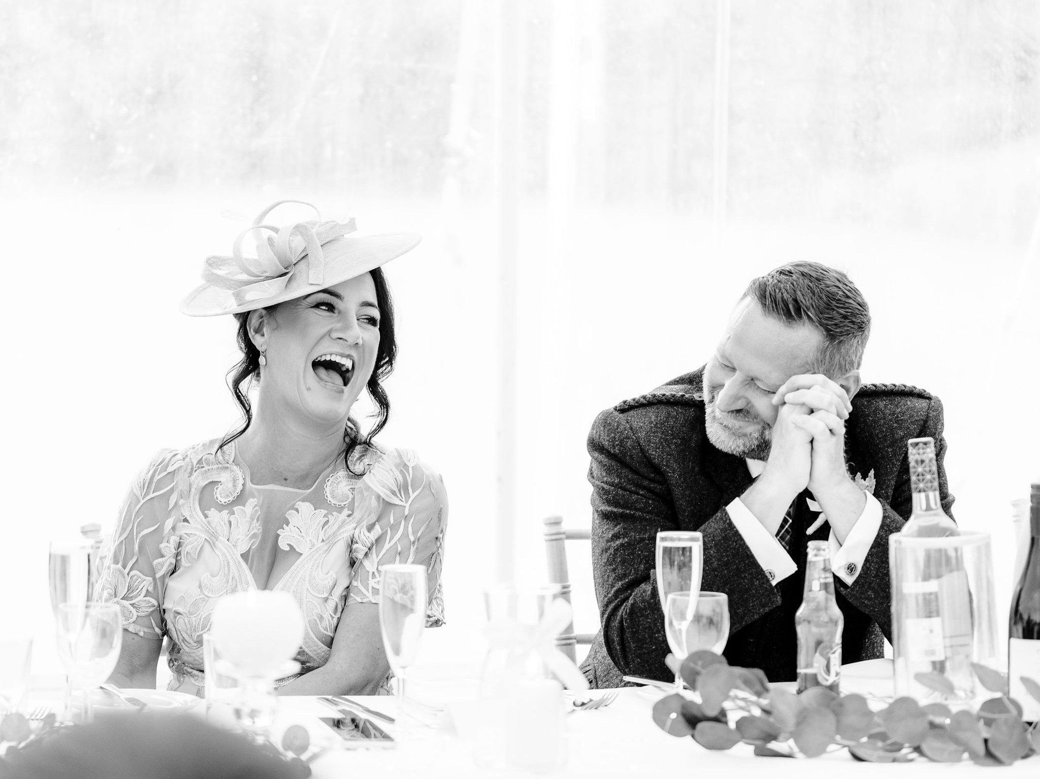 57_springkell-house-wedding-photographer-dumfries-scotland-guests-laughing.jpg