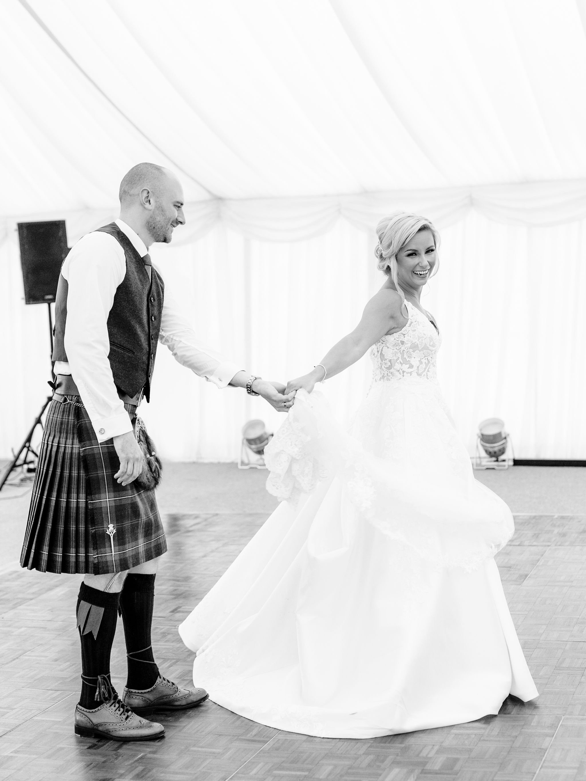 64_springkell-house-wedding-photographer-dumfries-scotland-bride-groom-dancing.jpg