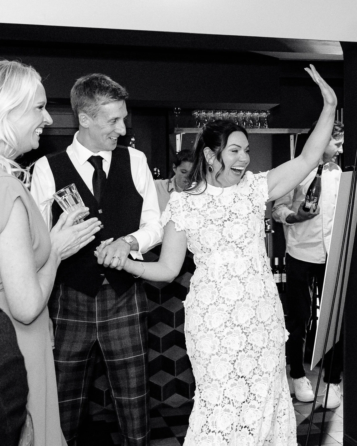 bride and groom walk into their wedding reception