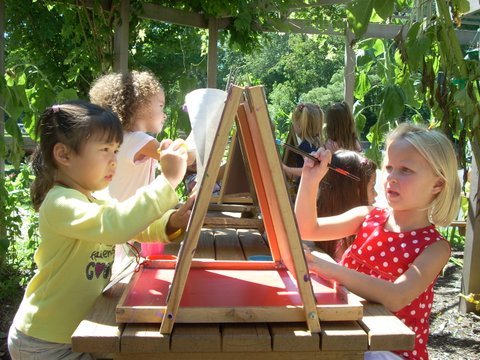 Painting is fun in the outdoor sunflower hut.