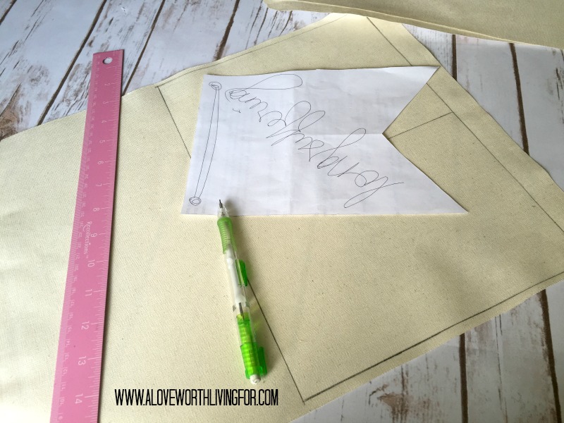 Use a pattern to trace your flags onto the back of the fabric.a