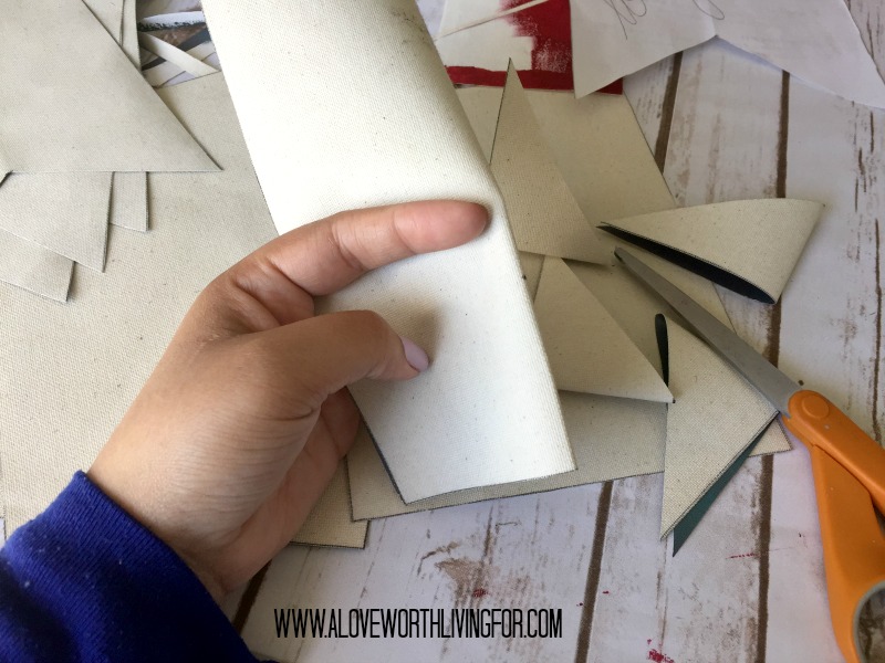 I folded each in half and cut out the triangles.