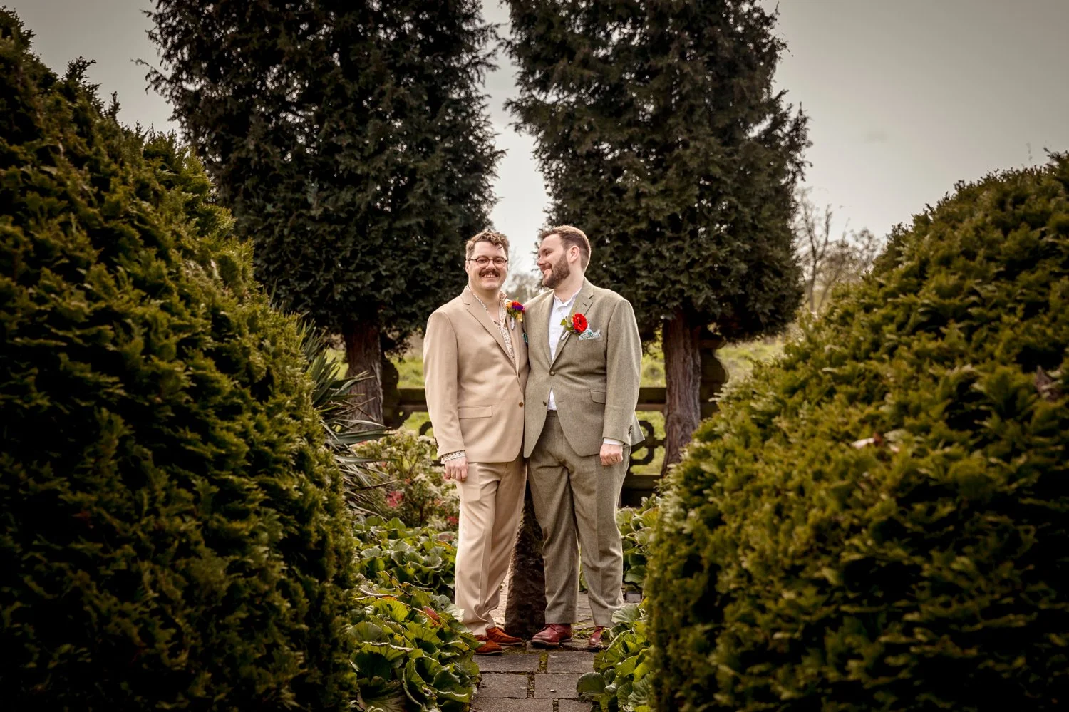 Matthew & Curtis holding each other in the grounds of Beaumanor Hall