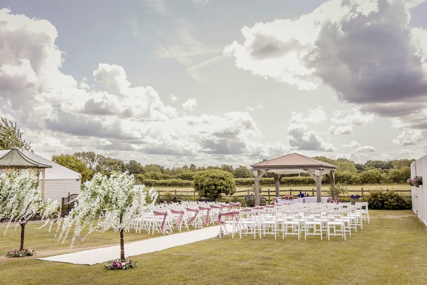 Outdoor ceremony overlooking the Elmthorpe countryside at Badgers Mount Hotel