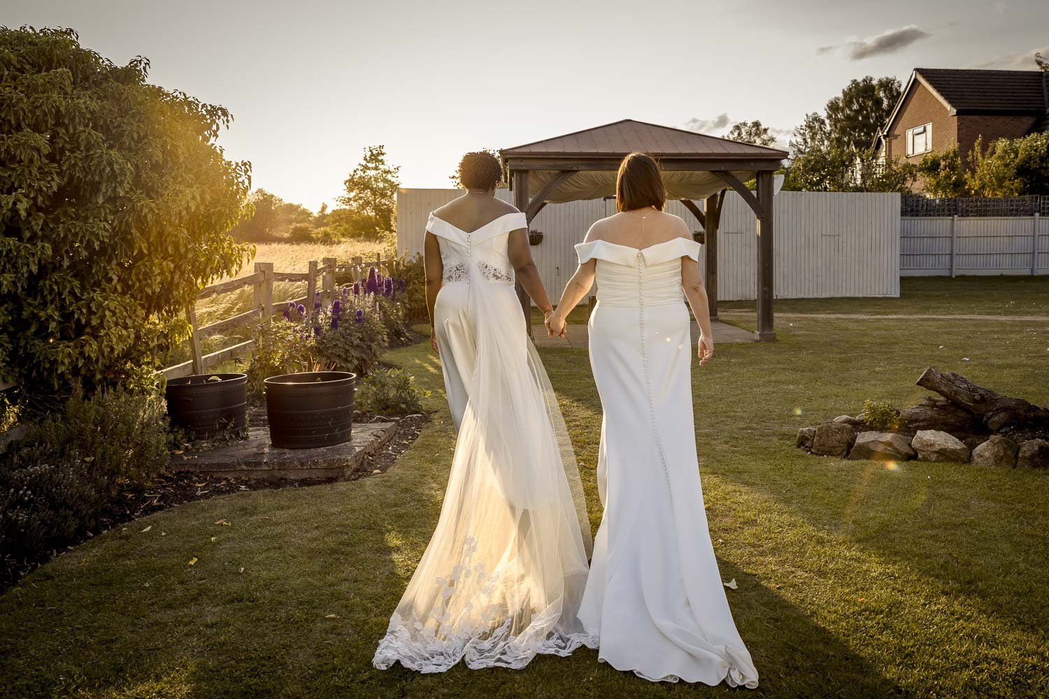 Brides walk in the grounds of Badgers Mount Hotel in Elmsthorpe Leicestershire