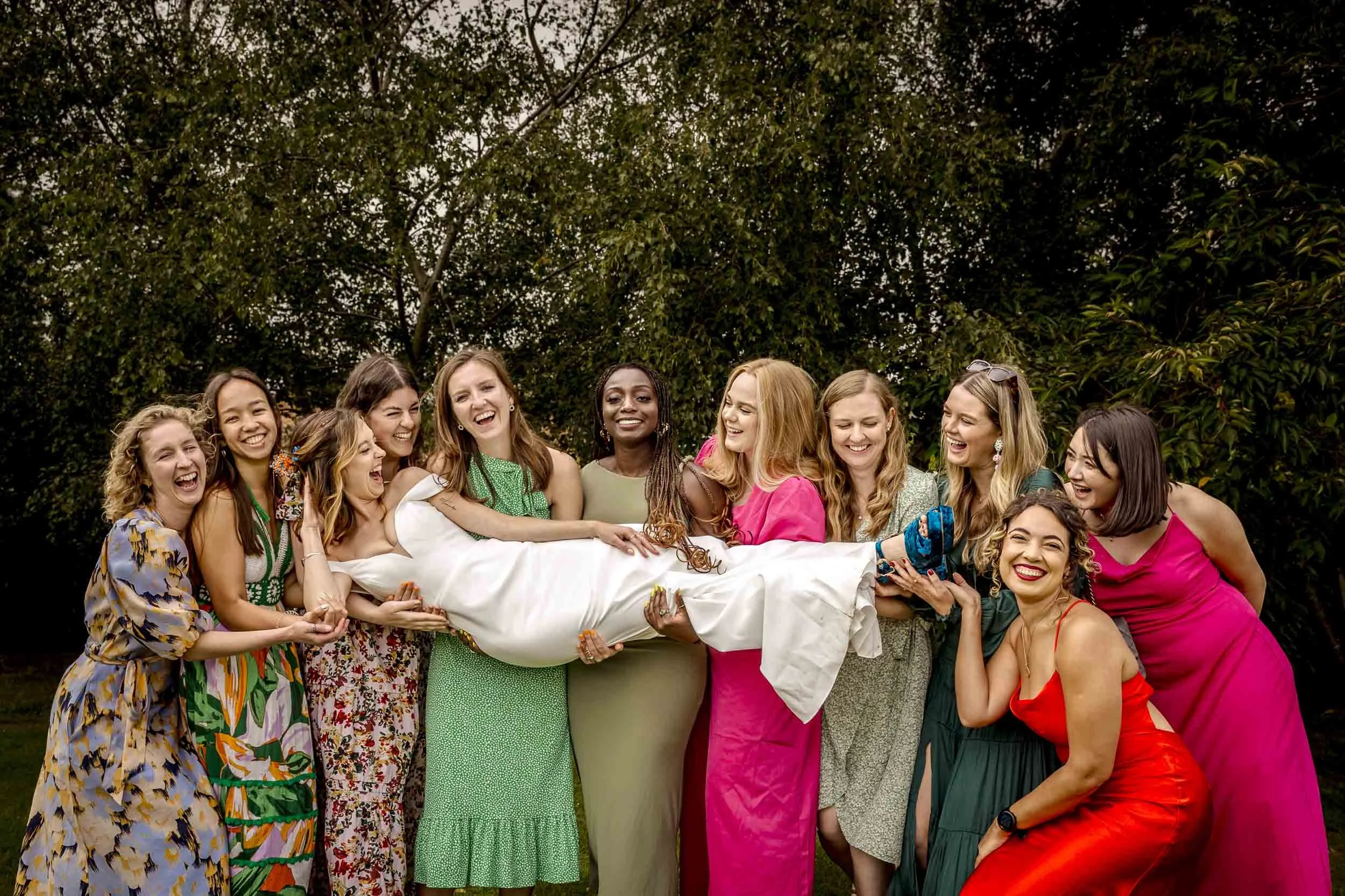 A bride is picked up by her besties