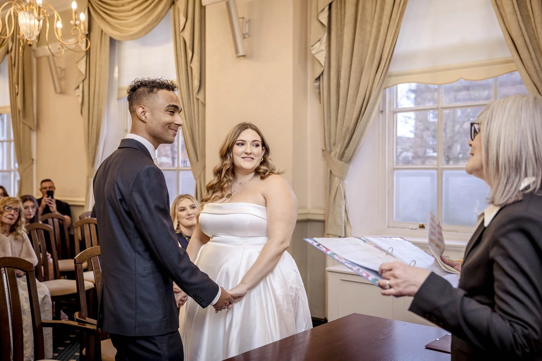 A registrar officiates a wedding ceremony in Leicester Town Hall registry office