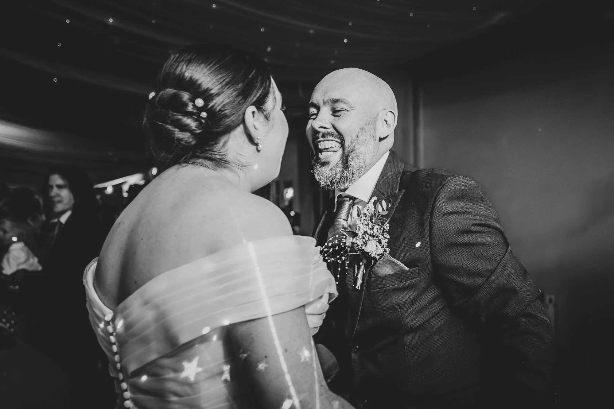 The bride and groom dance and sing to their upbeat first dance song at Warwick House in Warwickshire