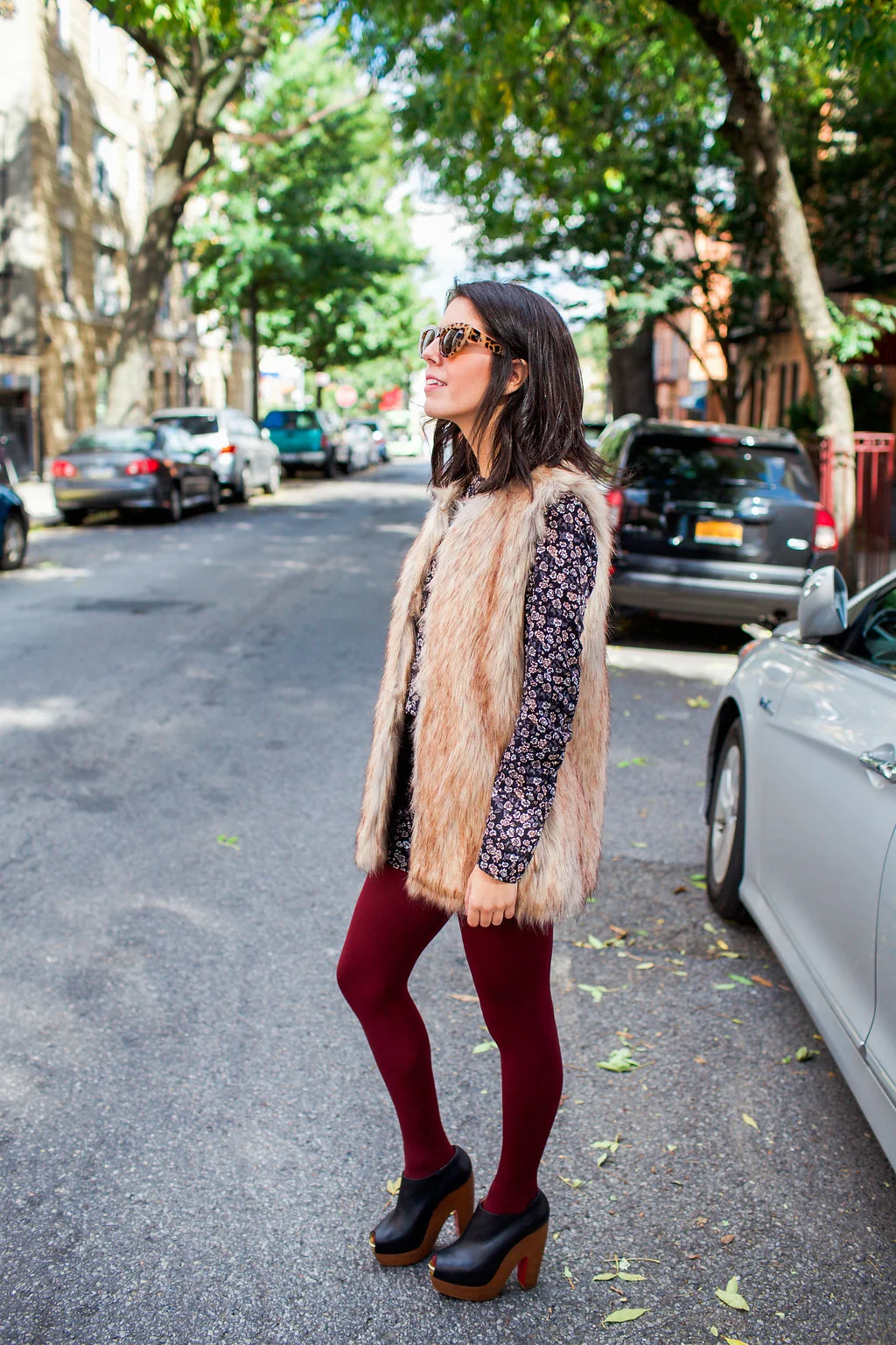  1970's fashion is back in full force with suede, fringe, (faux) fur and wide-leg jeans making a major comeback. With temperatures (very slowly) dropping I wanted to find a way to wear my favorite romper with a new twist.&nbsp;  A faux fur vest is a 