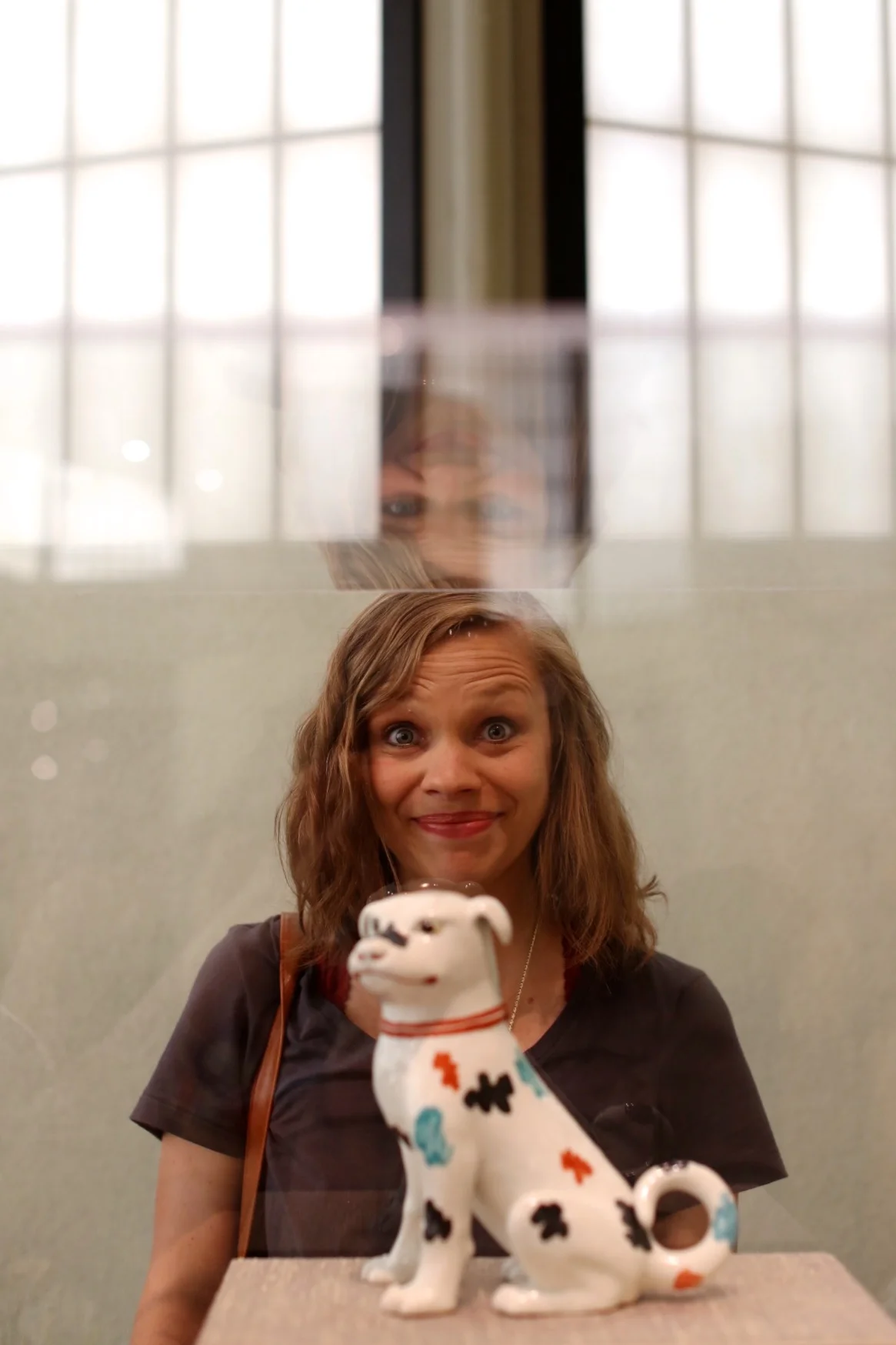 Abby and this ceramic dog in the Japanese Art Pavillon.