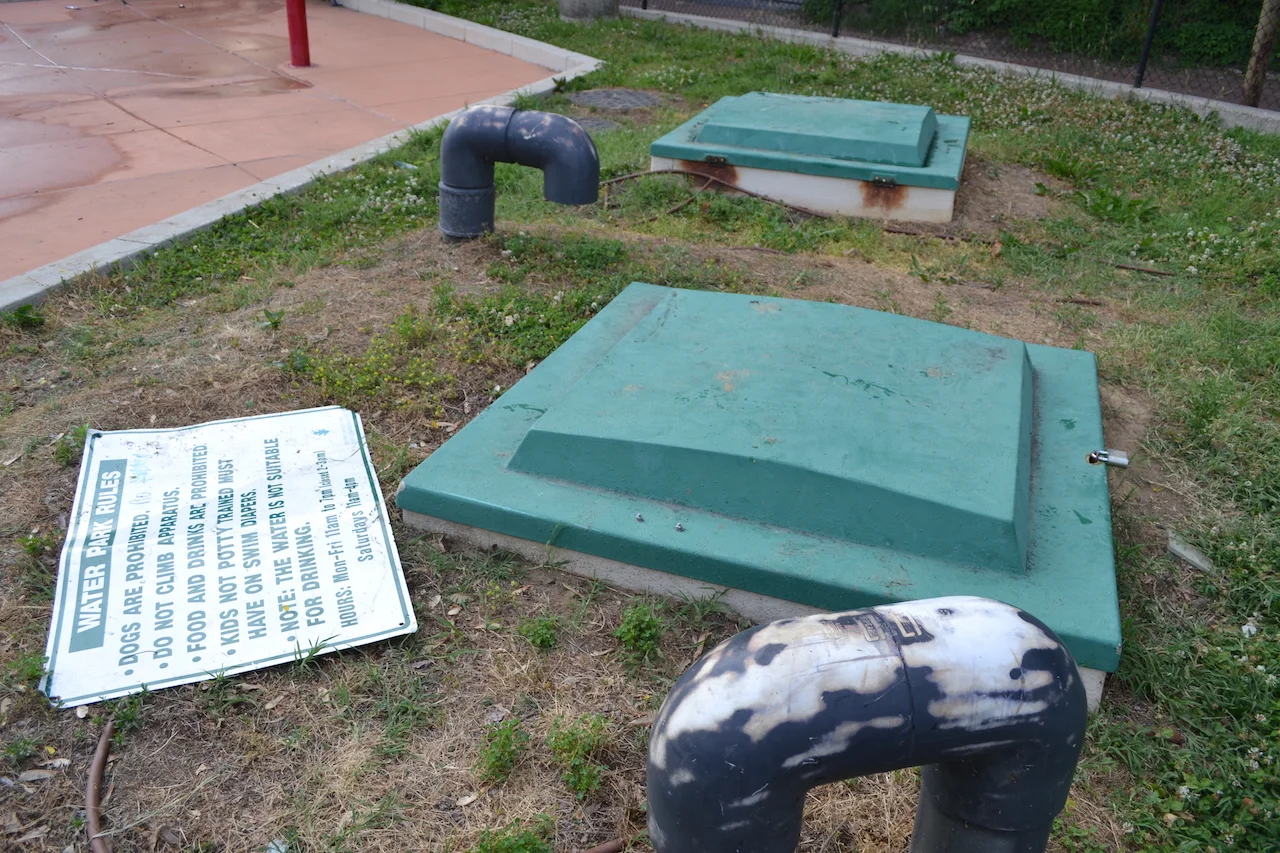 The green boxes are access panels for the water pump system and is where any pH level treatment would occur.