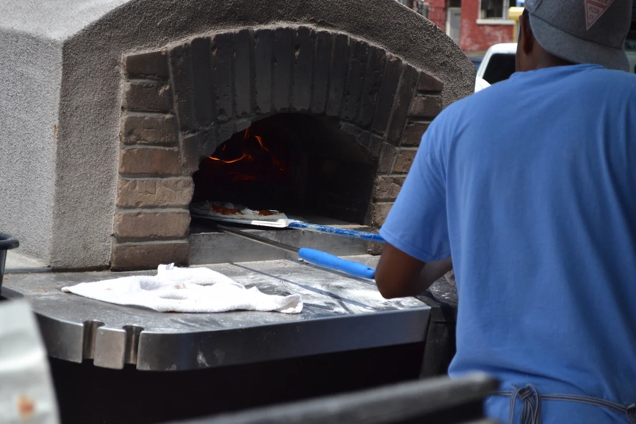 Into the brick oven it goes...