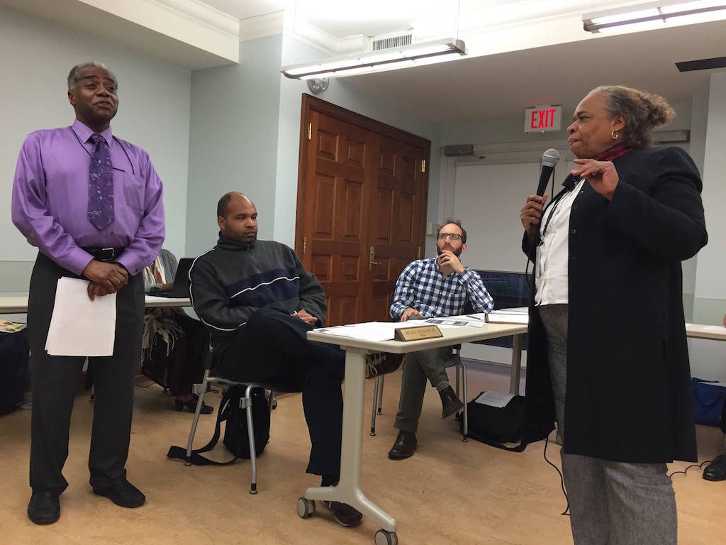Douglas Stallworth from WMATA talks with resident Milicent Toya about the proposal for an express bus on 14th Street at the April 8, 2015 ANC 4C meeting.