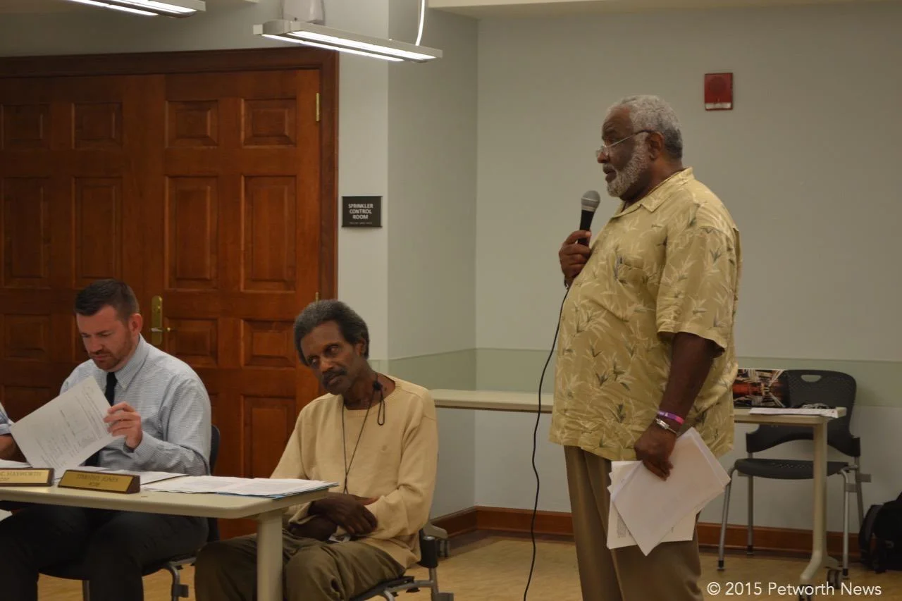 Commissioners John-Paul Hayworth, Timothy Jones and resident Grayson Dixon