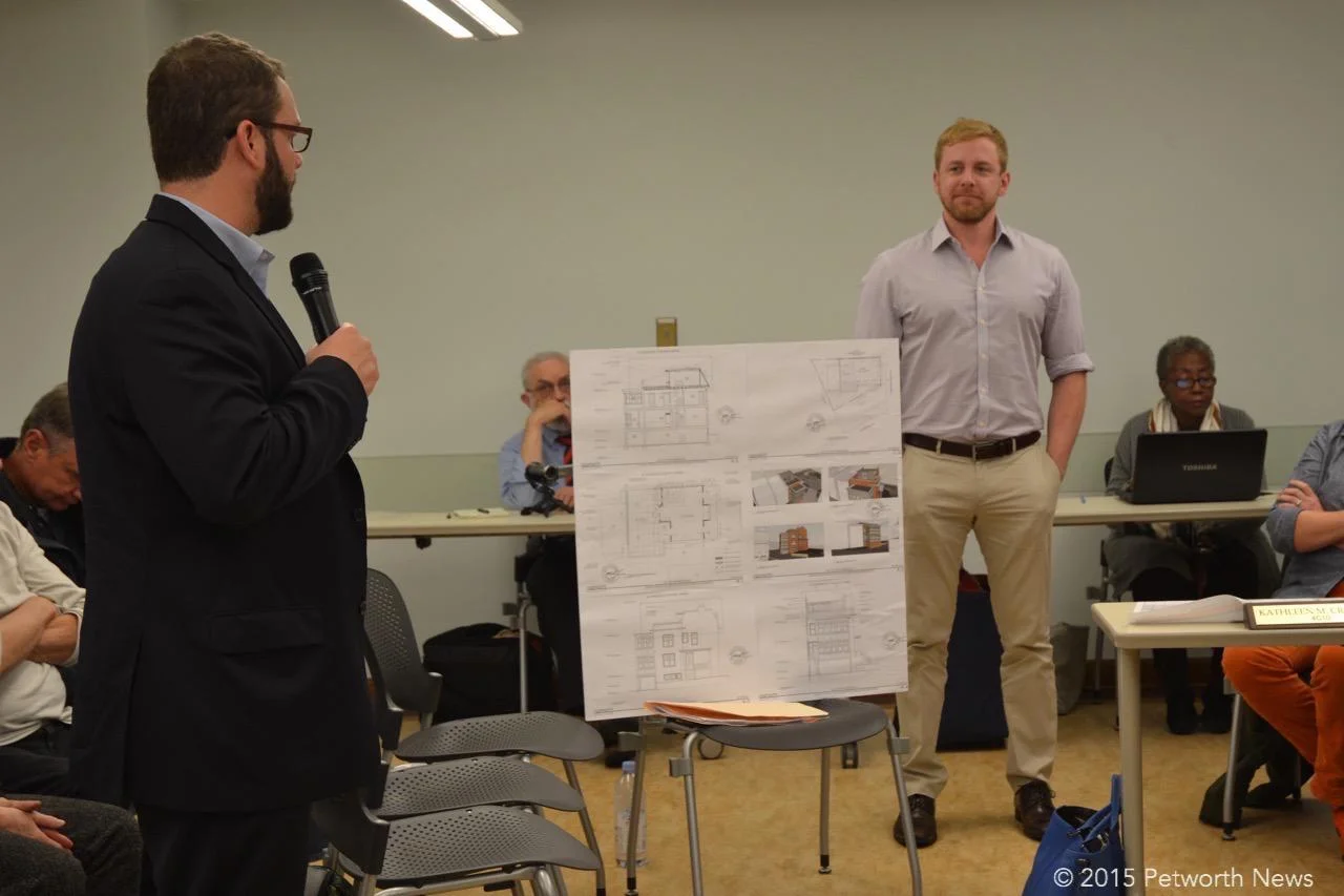 The owner of 3901 Illinois Ave (in the back) and his lawyer (?) discuss their request