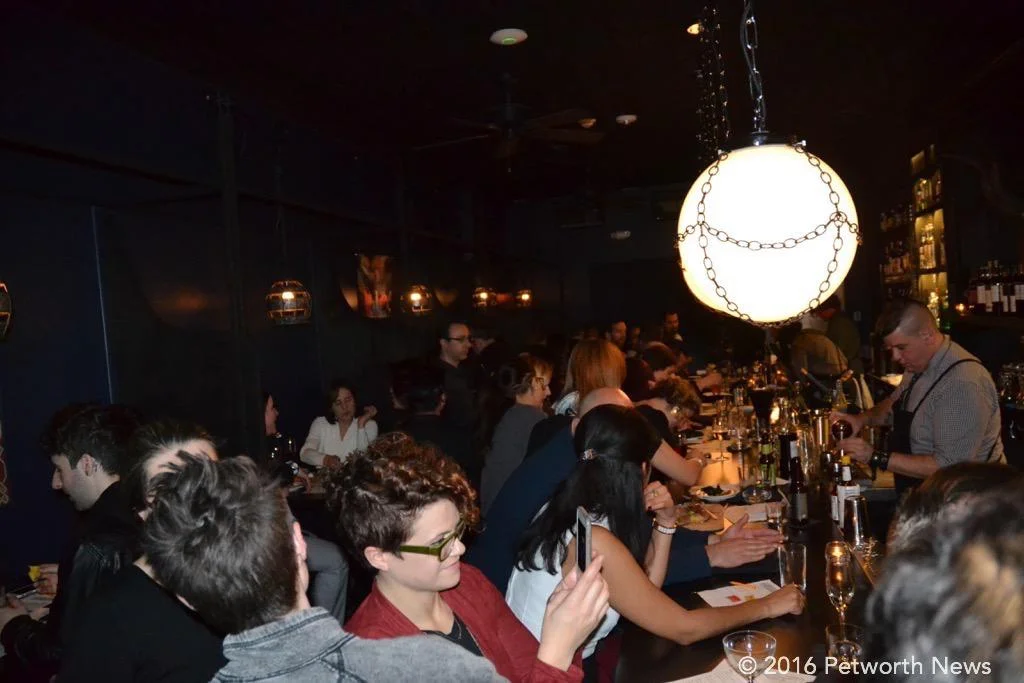 The crowd enjoying the mixed cocktails from the three bartenders.
